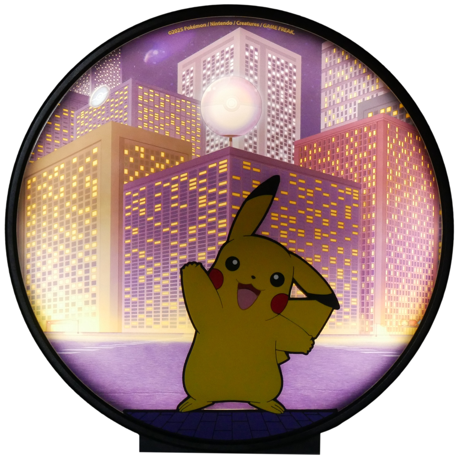 Pikachu in a city at night. Buildings with lit windows in the background. A Poke Ball and the moon are visible too.