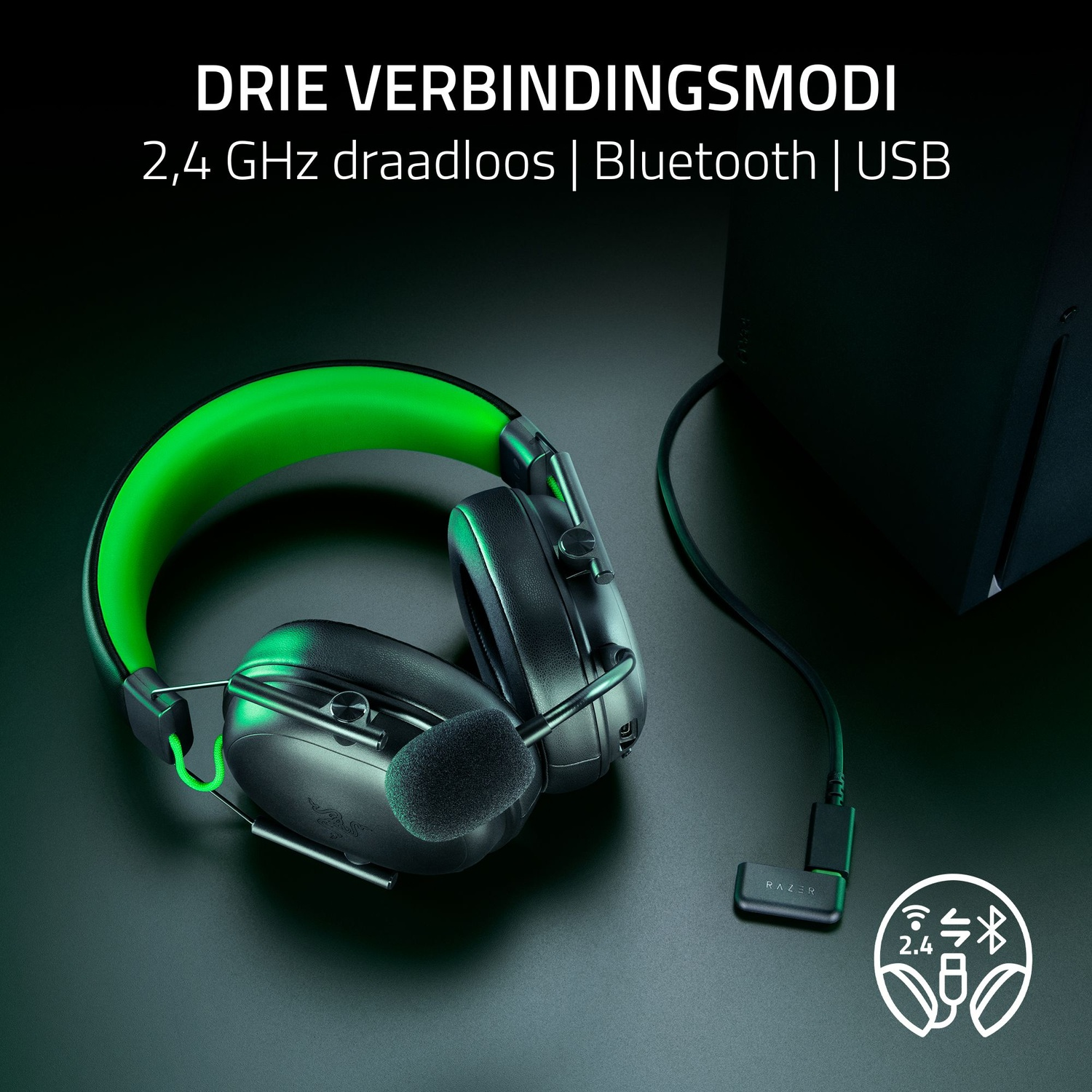 Black and green gaming headset with a microphone. The headset is connected to a black device via a USB cable. Text: 2.4 GHz wireless, Bluetooth, USB.