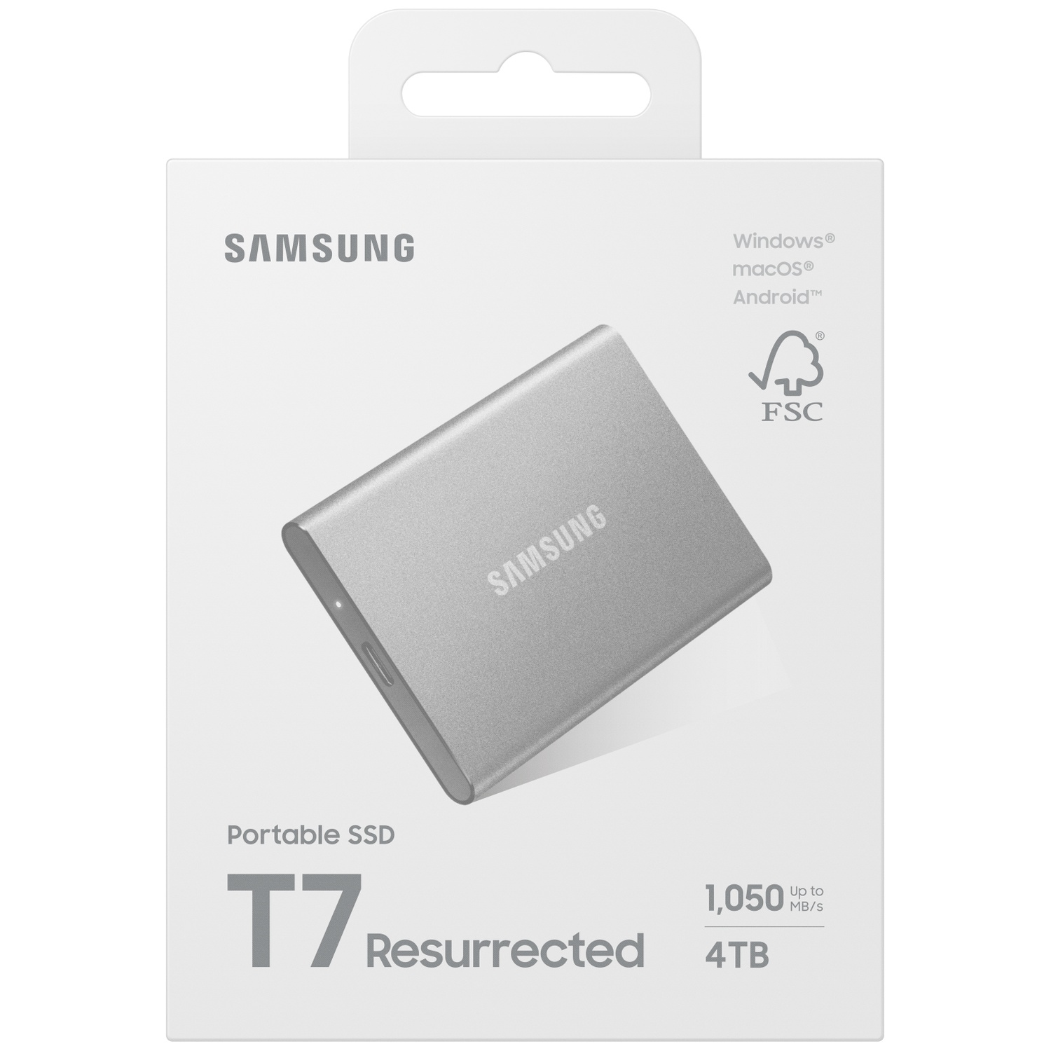 Een zilveren Samsung T7 portable SSD in de verpakking. De doos toont het merk, productinfo en compatibiliteitsdetails.