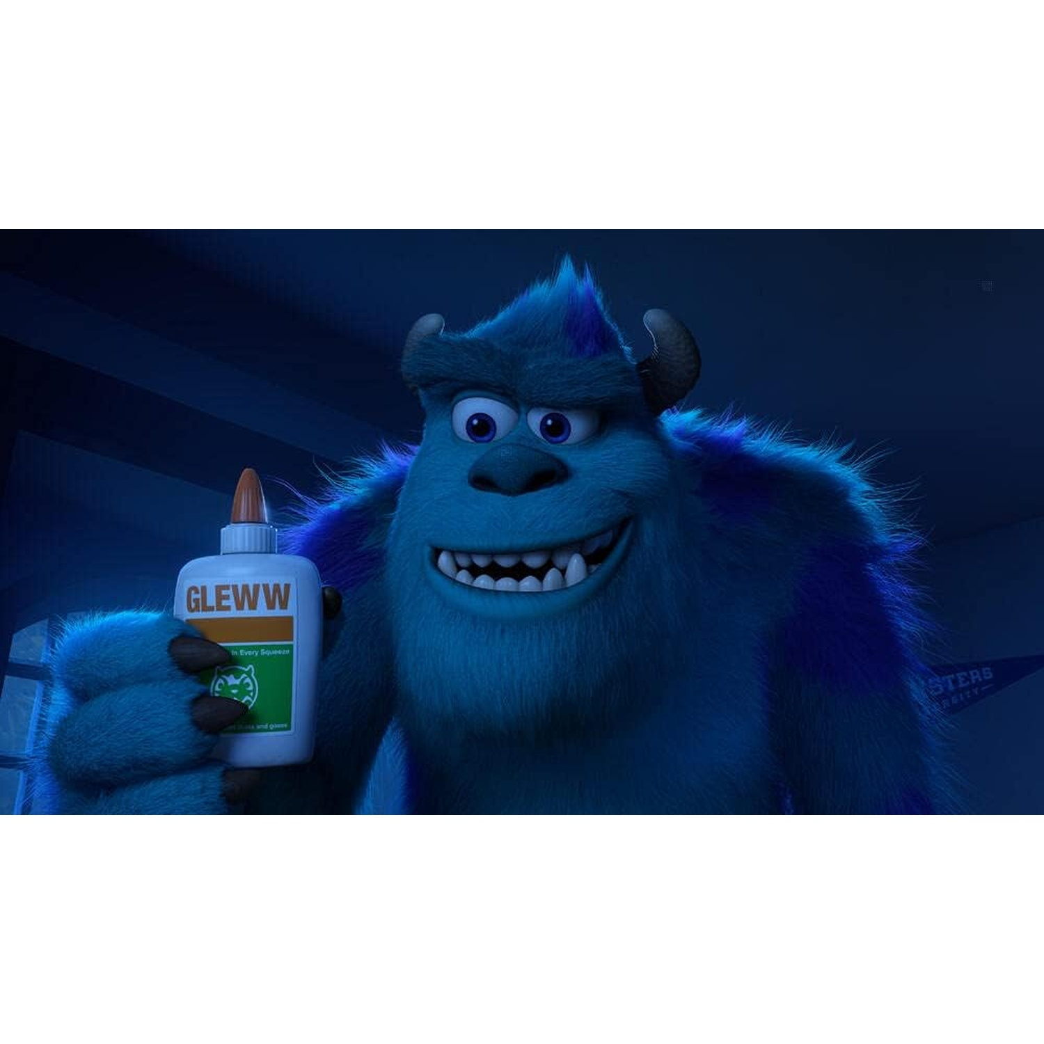 Sulley, from Monsters Inc., smiling, holding a glue bottle. He is blue with horns. Background is a Monsters University banner.
