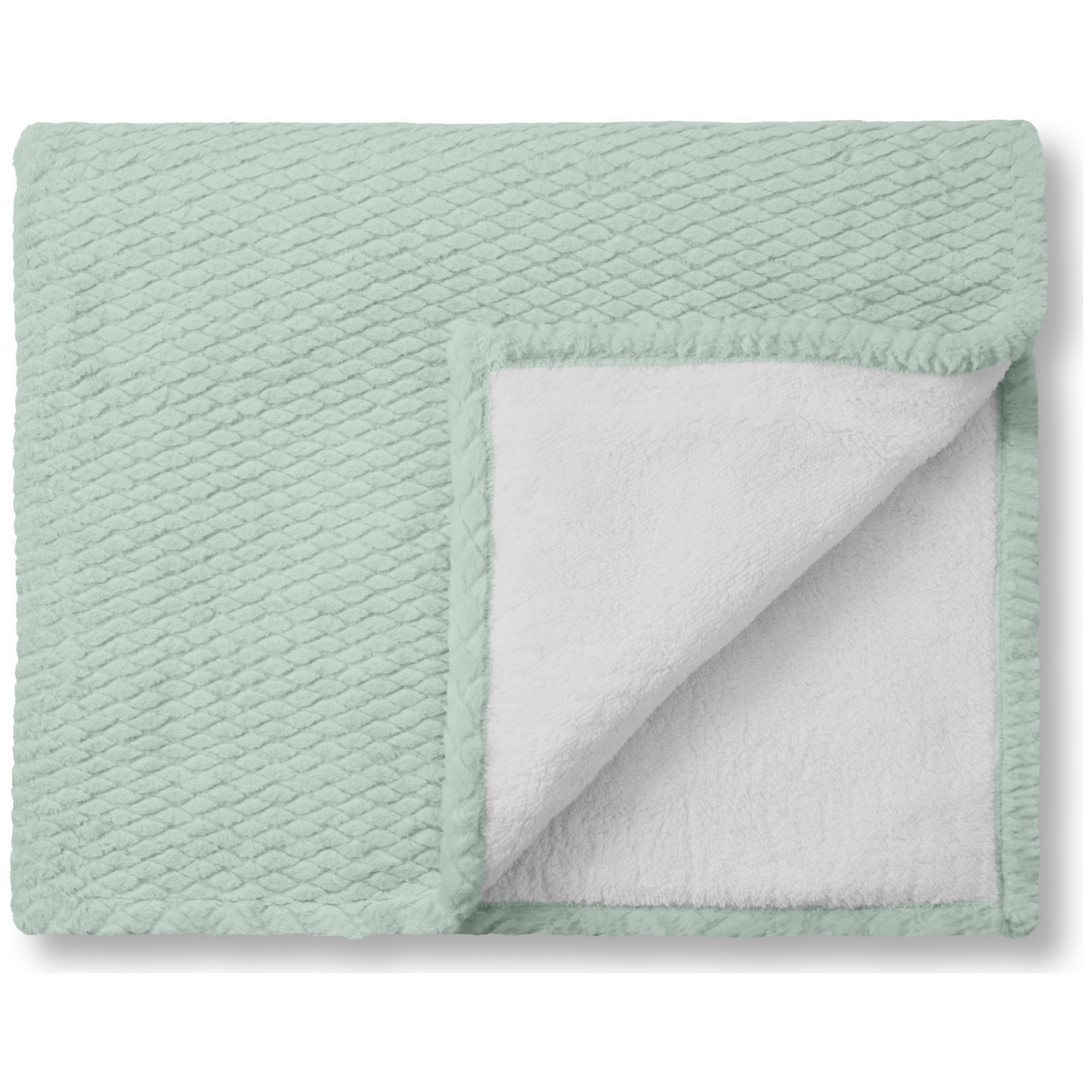 Une couverture pliée, vert clair avec un motif de losanges. L'intérieur est blanc et duveteux. Les bords sont vert foncé.