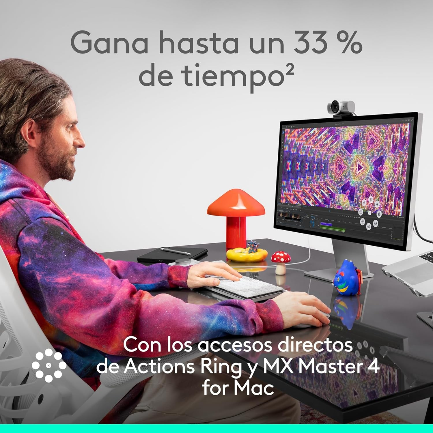 Hombre usando computadora con pantalla colorida. Objetos decorativos en el escritorio y texto arriba y abajo.
