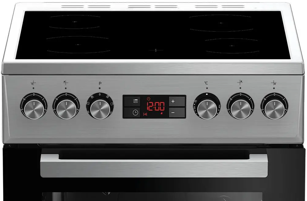 Zbliżenie srebrnego piekarnika z czarną szklaną płytą grzejną i elementami sterującymi. Na wyświetlaczu widnieje godzina 12:00.