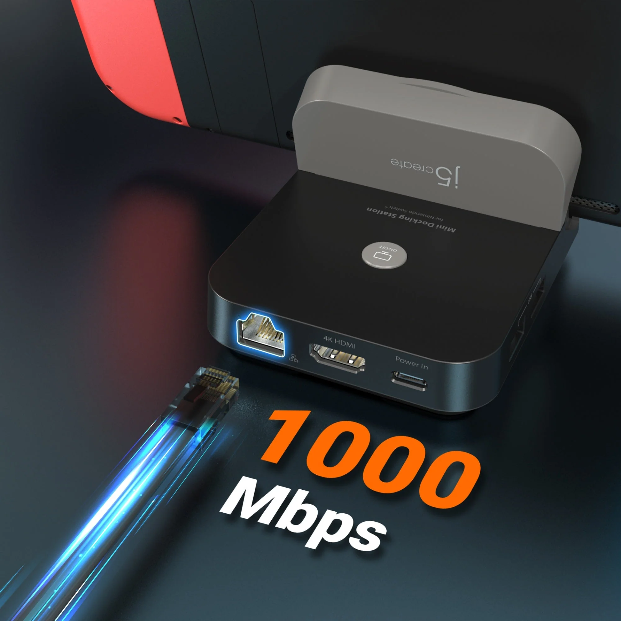 Fekete dokkolóállomás csatlakoztatott kábellel. Narancssárga 1000 Mbps szöveg. Háttérben egy Nintendo Switch.