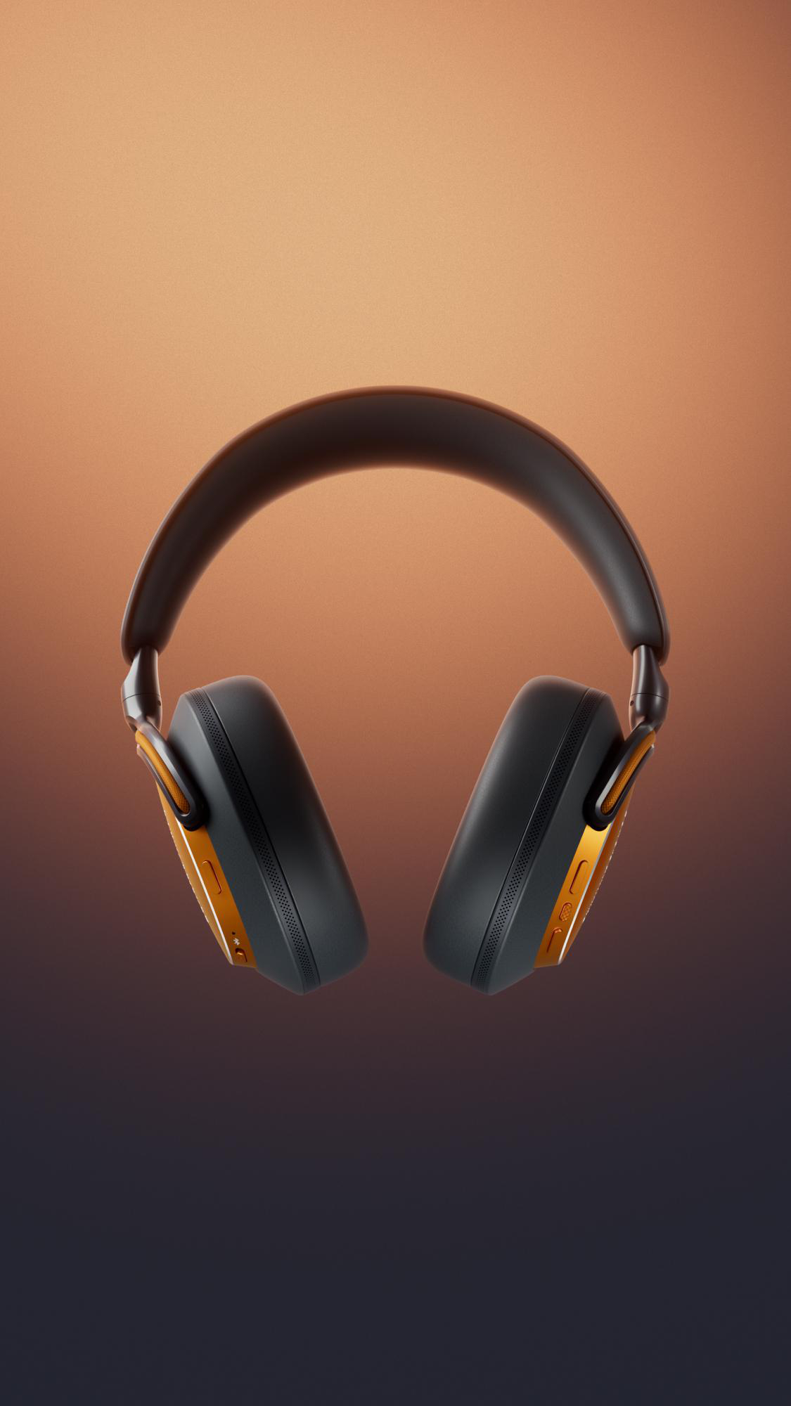 Schwarze und goldene Kopfhörer vor einem braunen Hintergrund. Die Ohrmuscheln sind schwarz und gold. Das Kopfband ist schwarz.