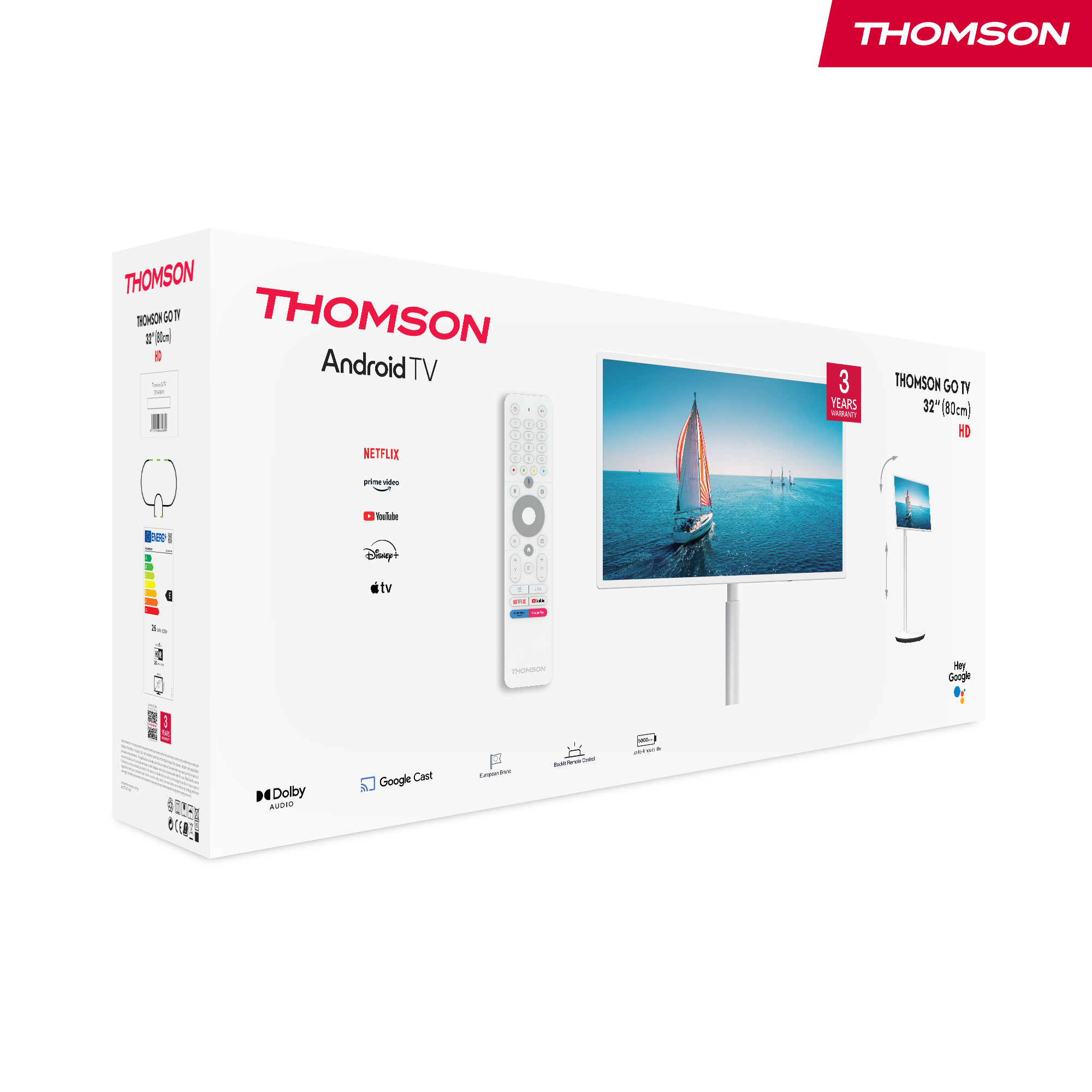 Una caja de TV Android Thomson. Incluye un mando a distancia y la pantalla del televisor muestra un velero en el agua.