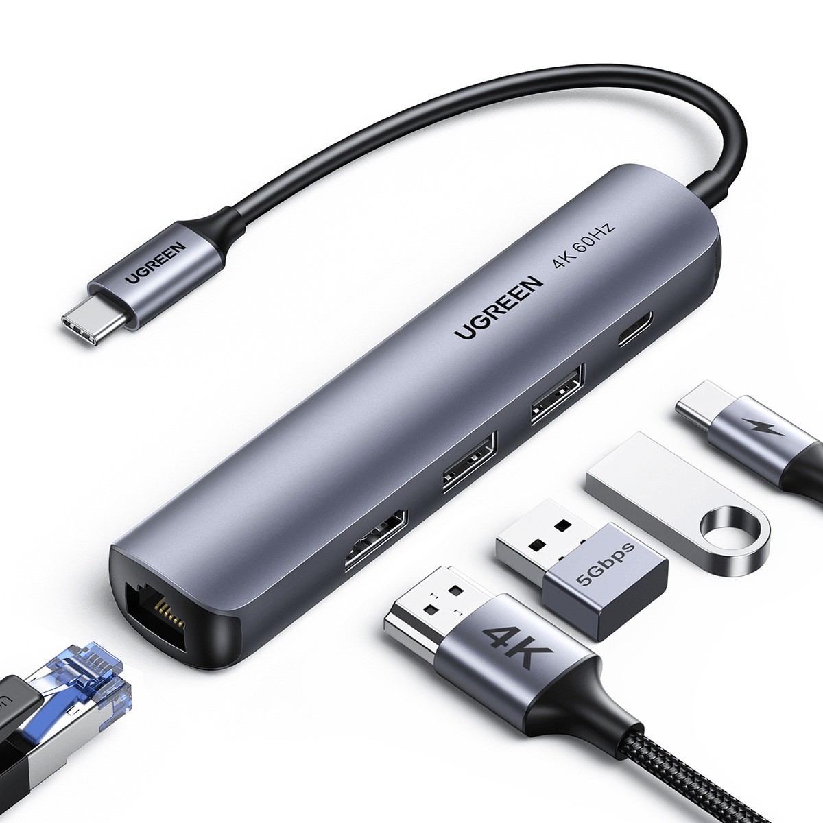Concentrador UGREEN con múltiples puertos, cables y unidades USB. Los colores gris y plateado dominan con fondo blanco.