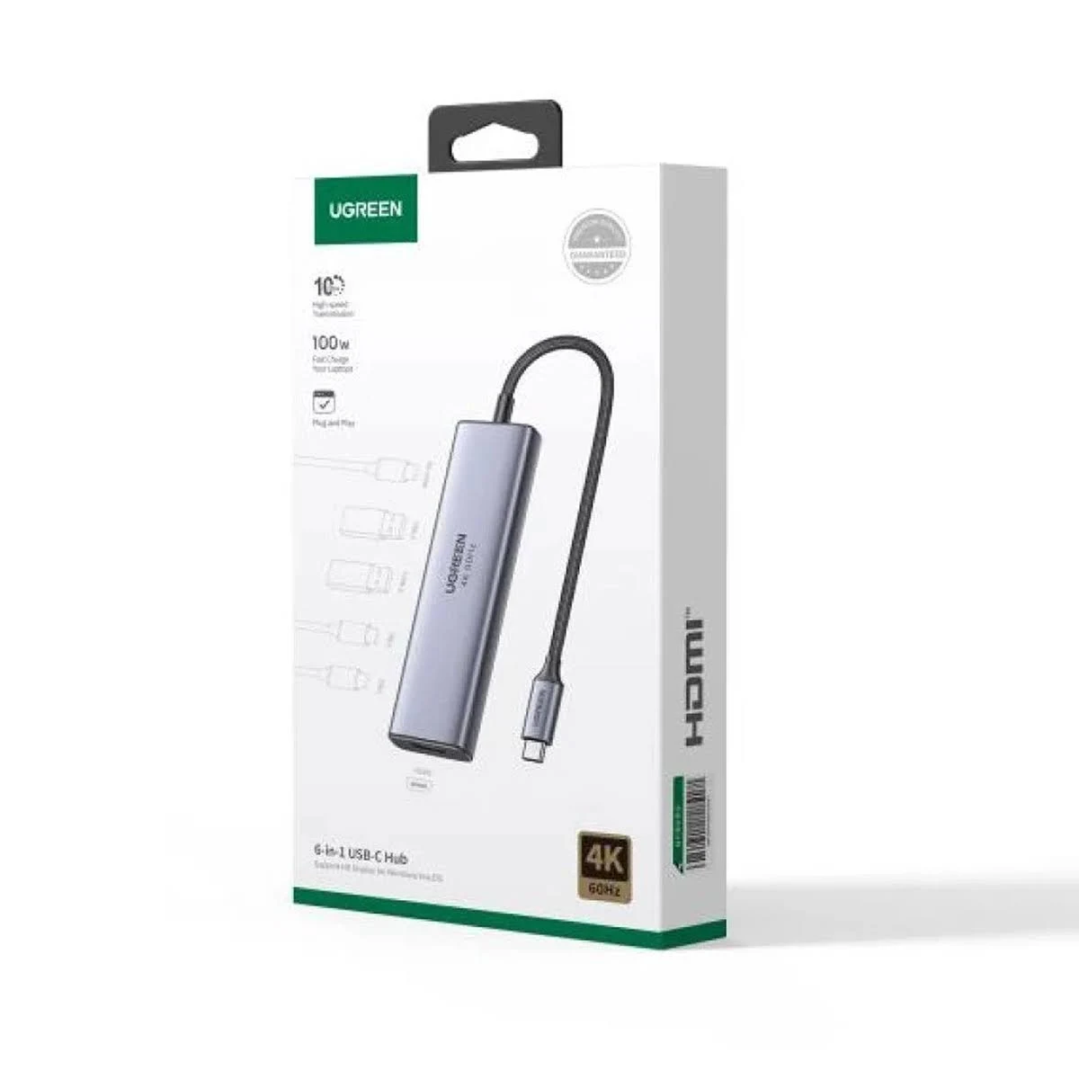 Se muestra una caja del concentrador USB-C 6 en 1 UGREEN. La caja es blanca con detalles en verde y muestra el producto y sus funciones.