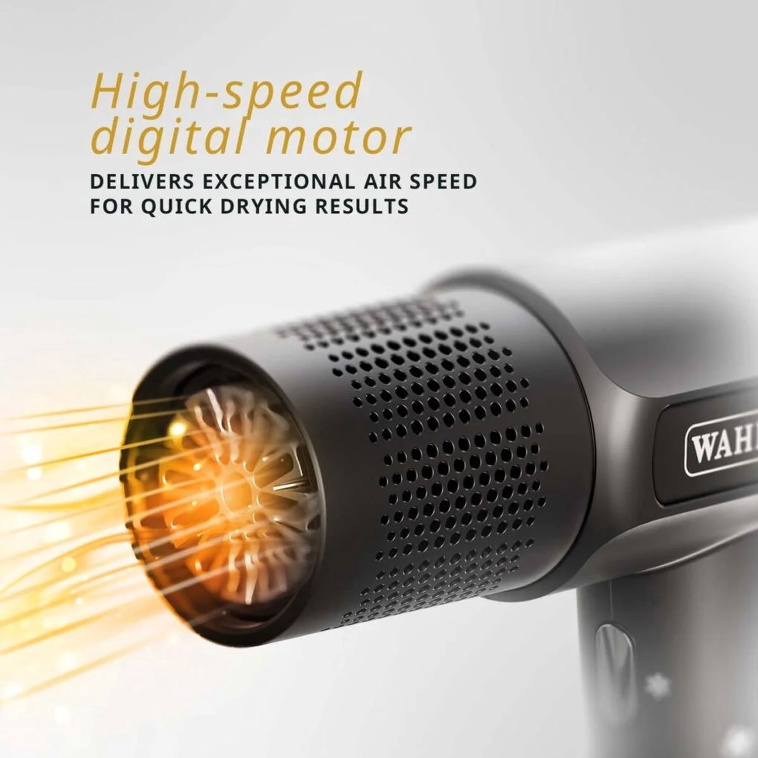 Close-up of a black hair dryer with the brand name 'WAHL'. The dryer emits warm light.
