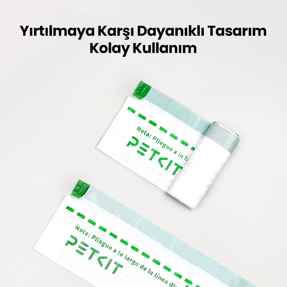 İki beyaz PETKIT çantası, biri rulo halinde. Çantalar üzerinde yeşil vurgular ve metin. Türkçe metin: 'Yırtılmaya Dayanıklı Tasarım, Kolay Kullanım'.