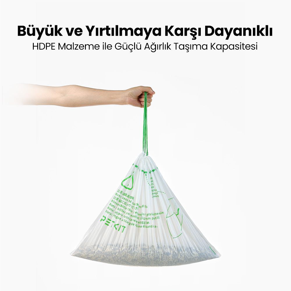 Bir el, yeşil bir ip ile kahverengi malzeme dolu beyaz bir torbayı tutuyor. Üstte Türkçe metin.