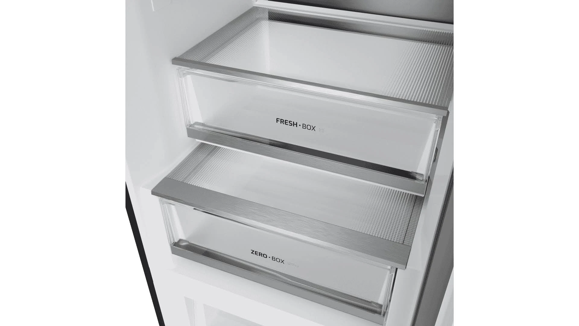 Dentro de un refrigerador, se ven dos cajones transparentes con las etiquetas 'FRESH BOX' y 'ZERO BOX', con detalles metálicos.