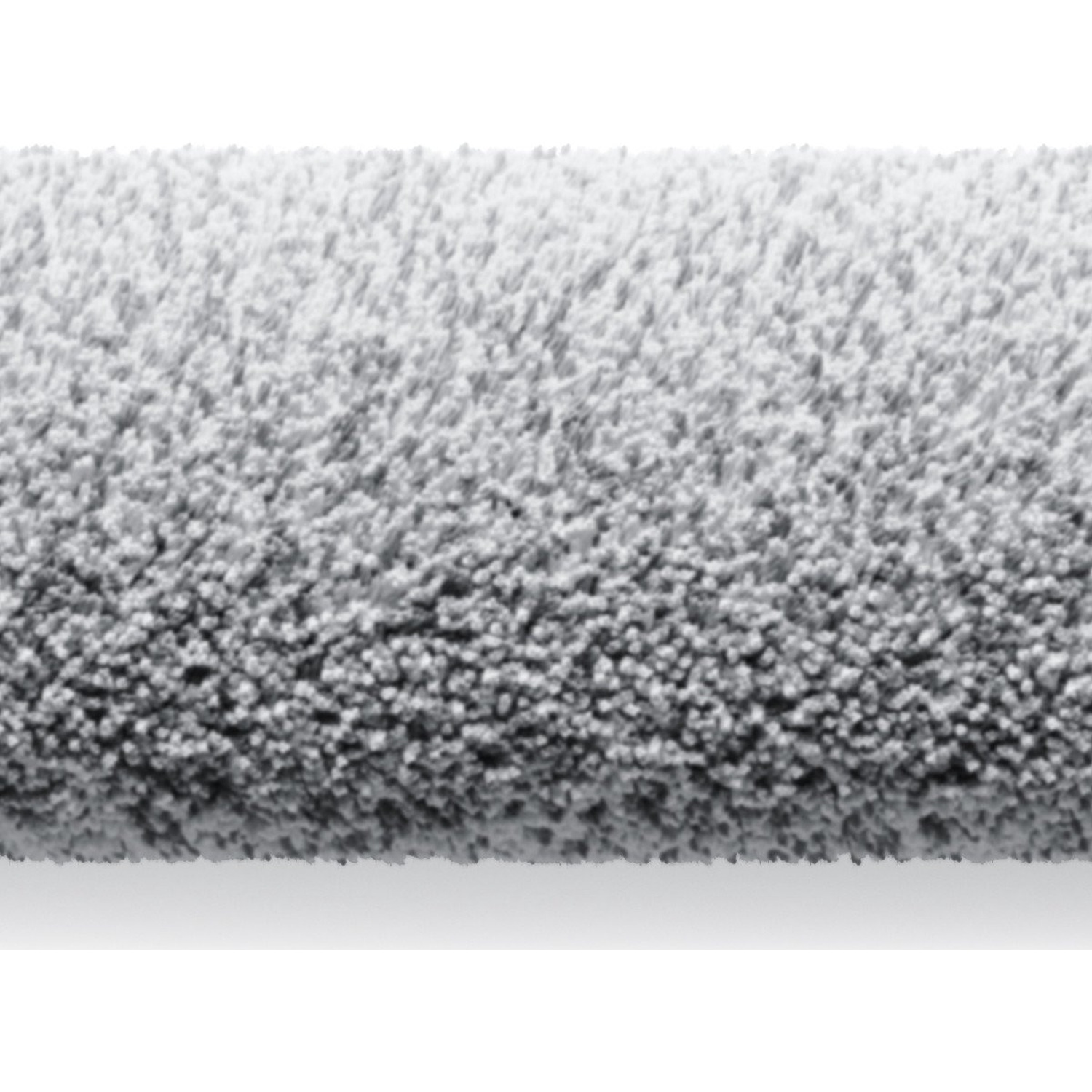 Gros plan d'une surface grise texturée, peut-être un tapis ou un tissu. La texture est dense avec un léger dégradé.