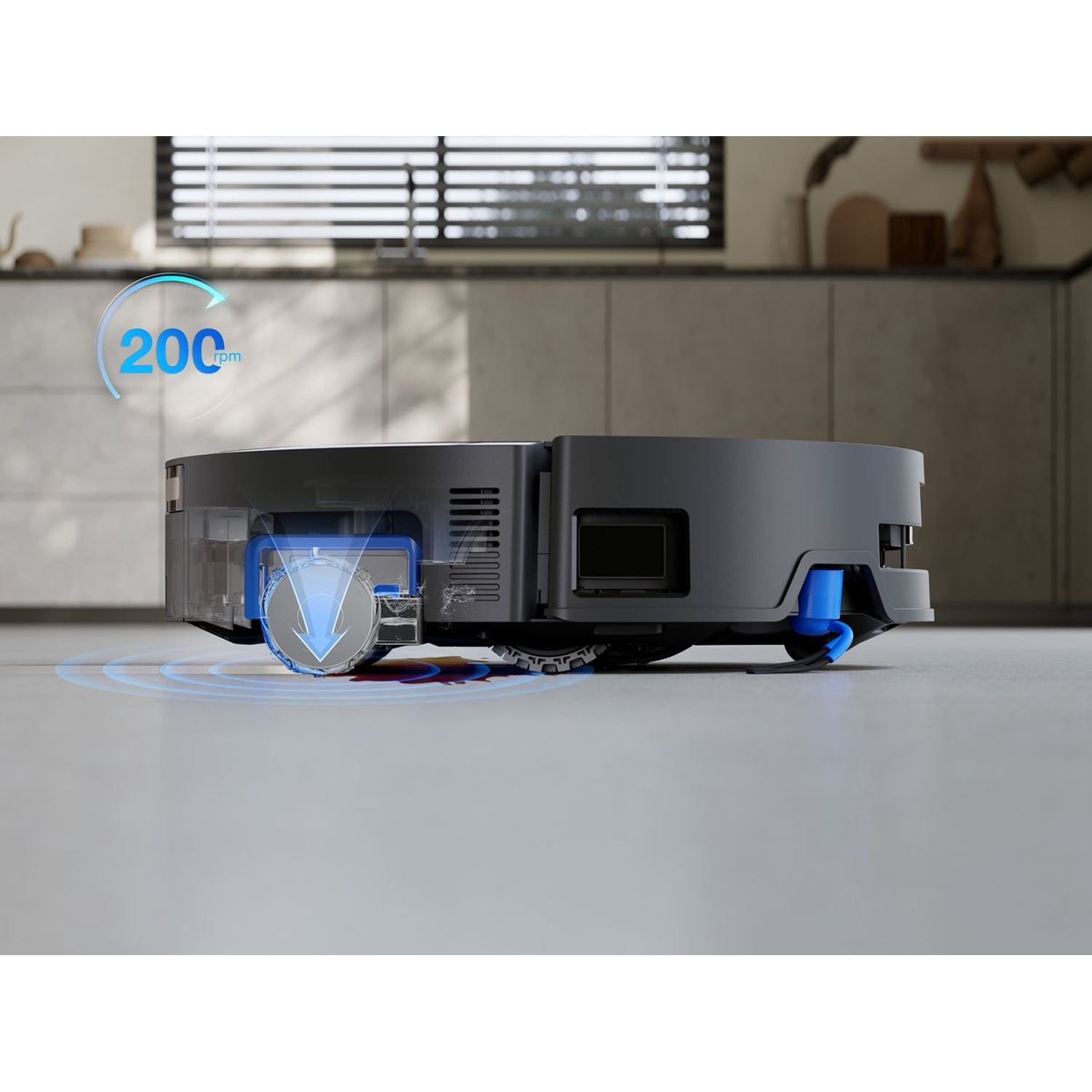 Een robotstofzuiger met een blauw en grijs ontwerp. Het heeft een roterende borstel en een indicator van 200 rpm. De achtergrond is een keuken.