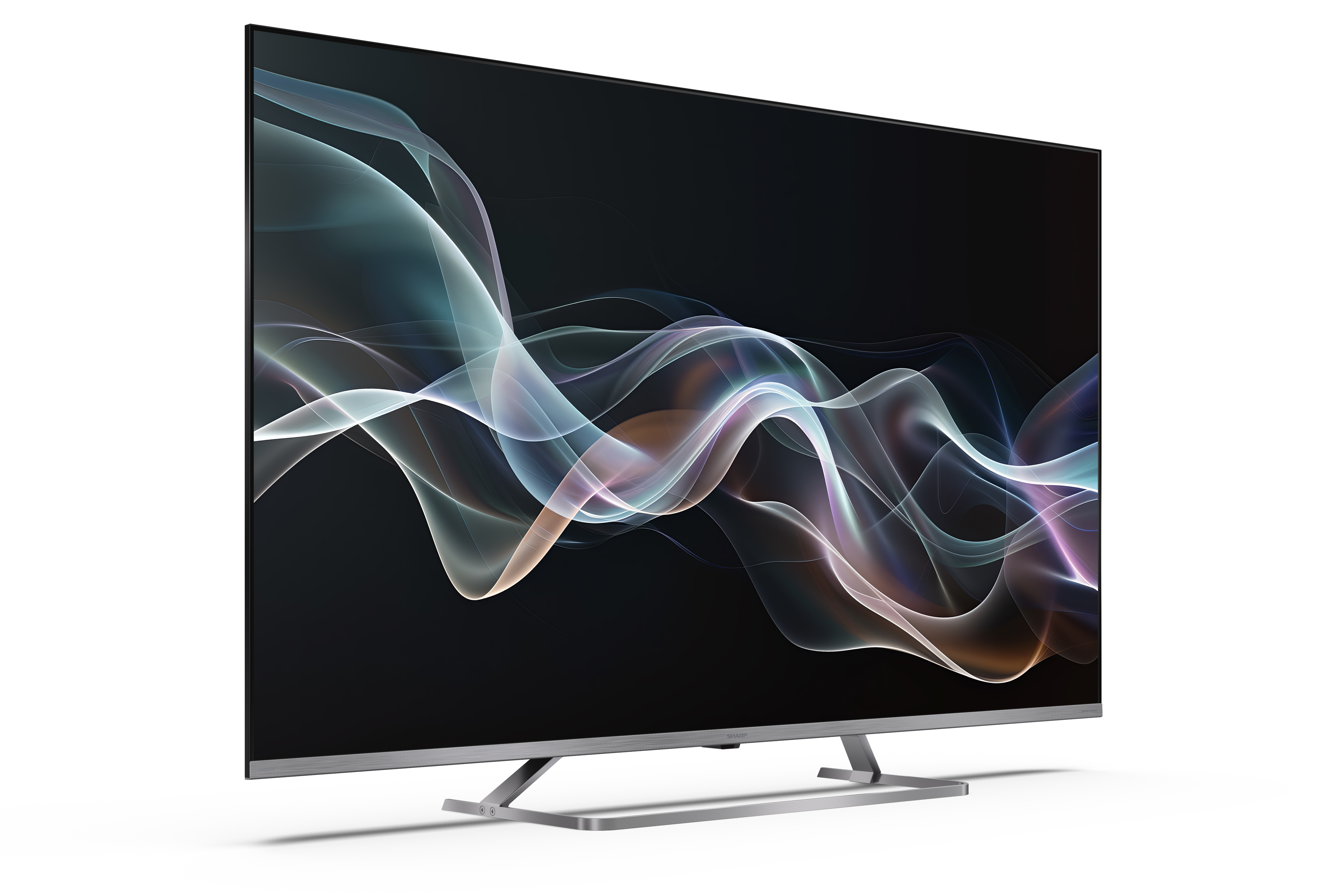 Egy modern TV fekete képernyőn absztrakt dizájnt jelenít meg. Fehér felületen áll.