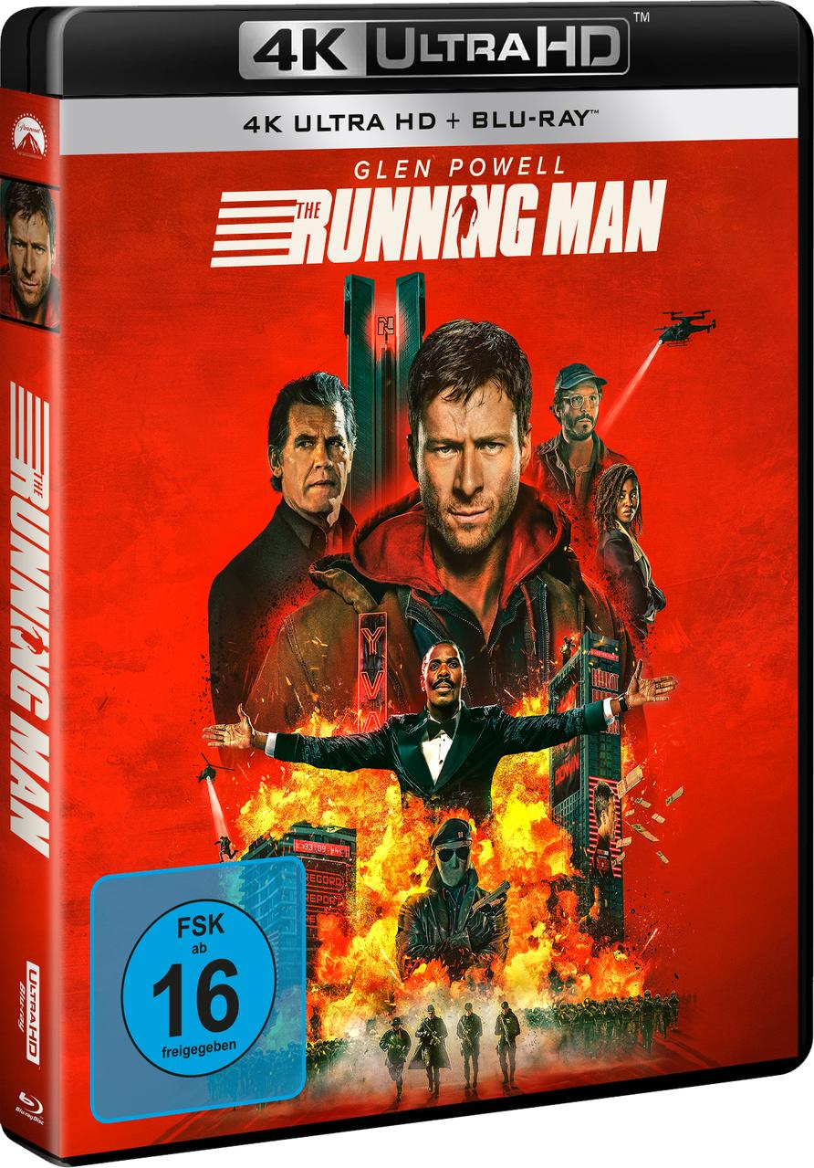The Running Man Blu-ray-Cover. Zeigt Glen Powell, einen Mann in roter Jacke, und andere Schauspieler mit feurigem Hintergrund.