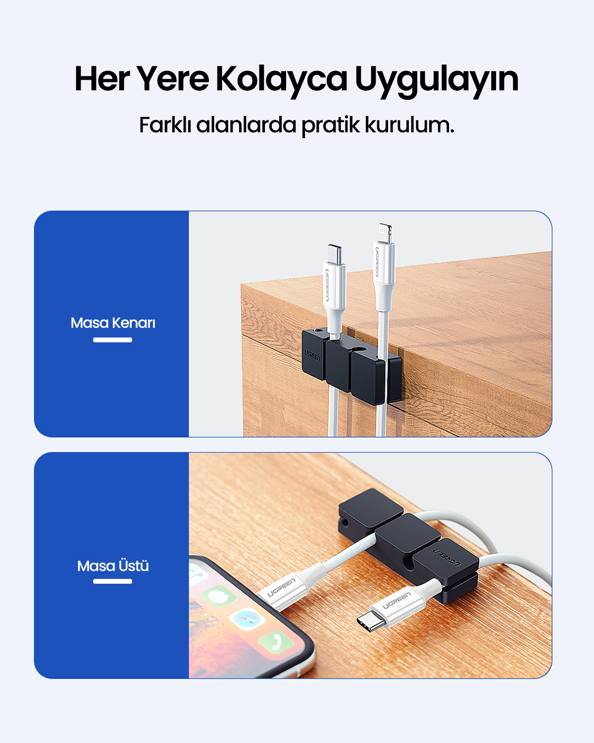 Görüntüde kablo düzenleyiciler gösteriliyor, biri bir masa kenarında, diğeri ise masa üstünde. Kablolar beyaz, düzenleyiciler siyah, telefon masada.
