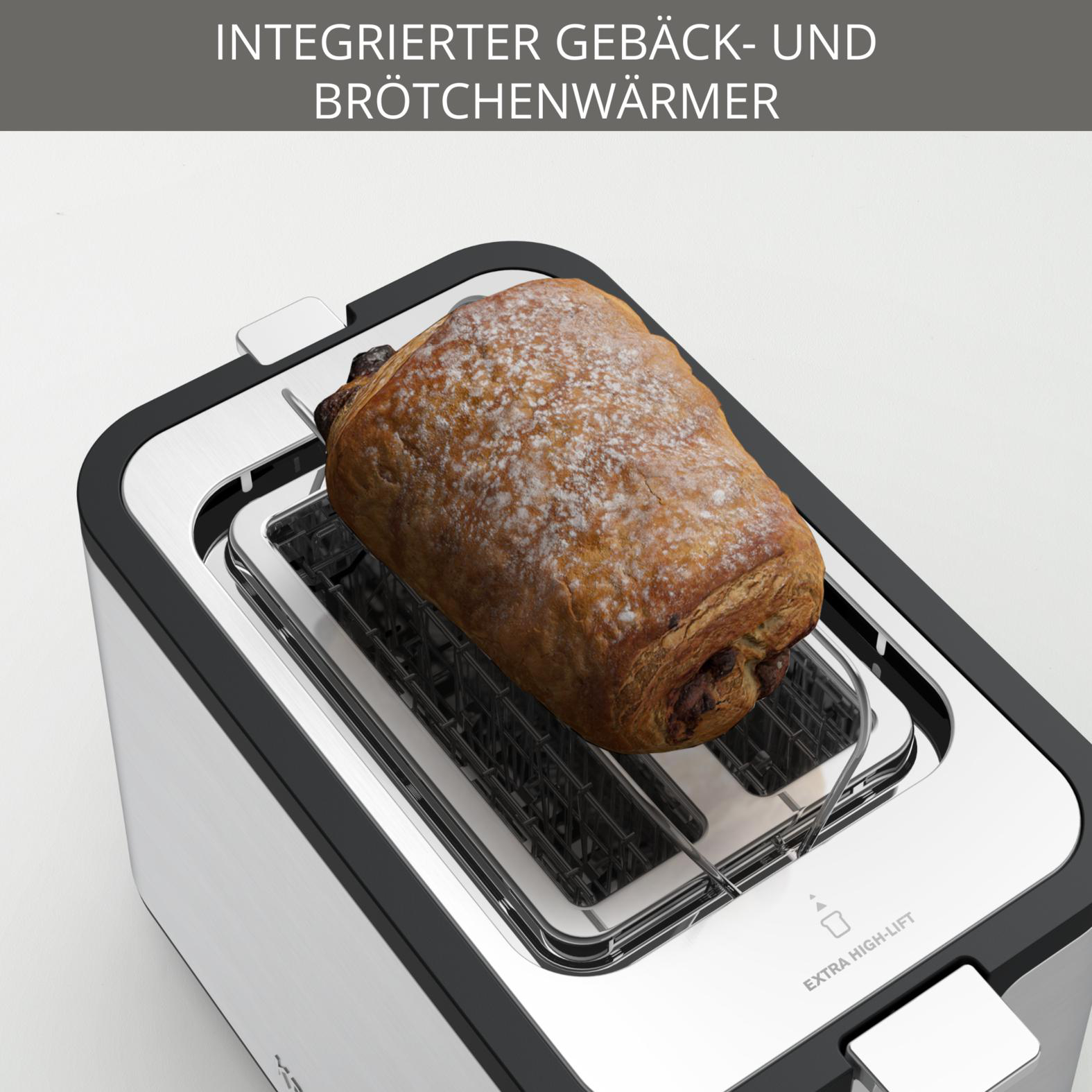 Ein Toaster mit Gebäck. Der Toaster ist silber und schwarz.