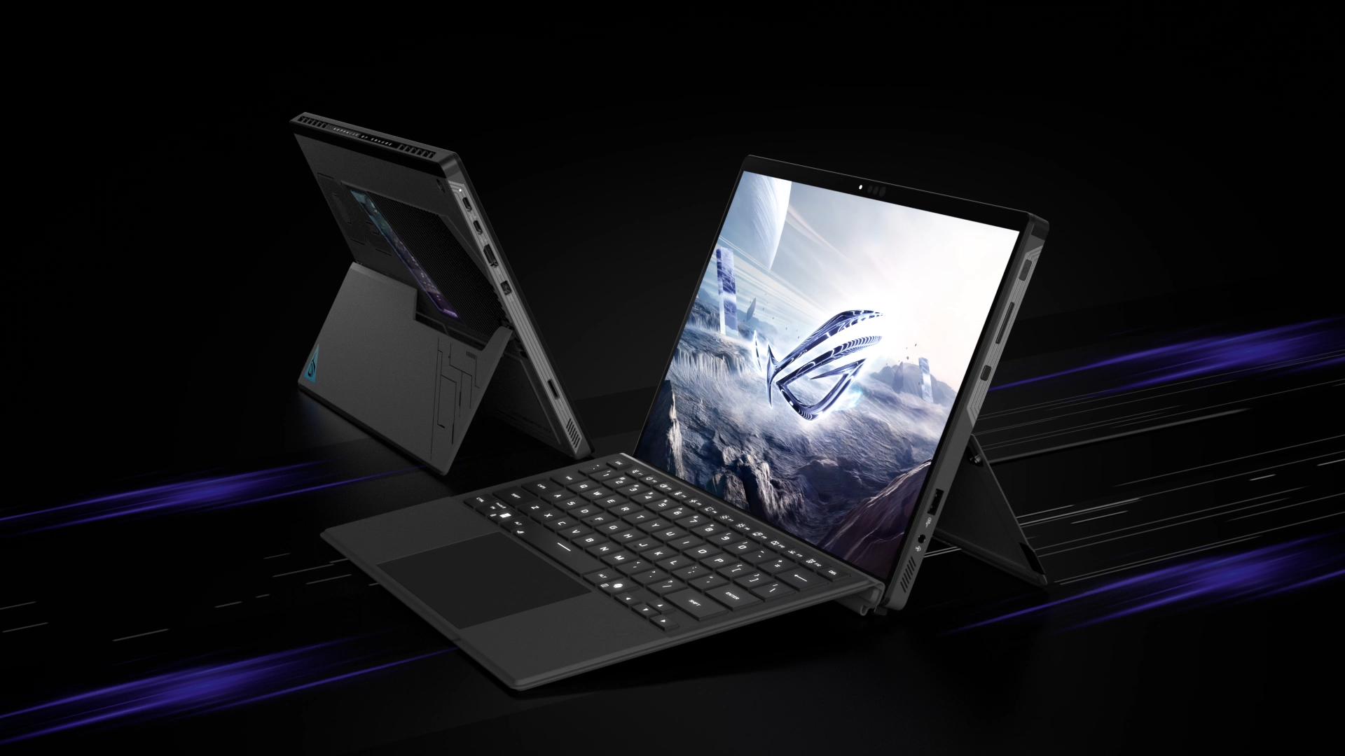Two black laptops are displayed. One is open, showing a landscape with a logo. The other is closed. Both are on a black surface.