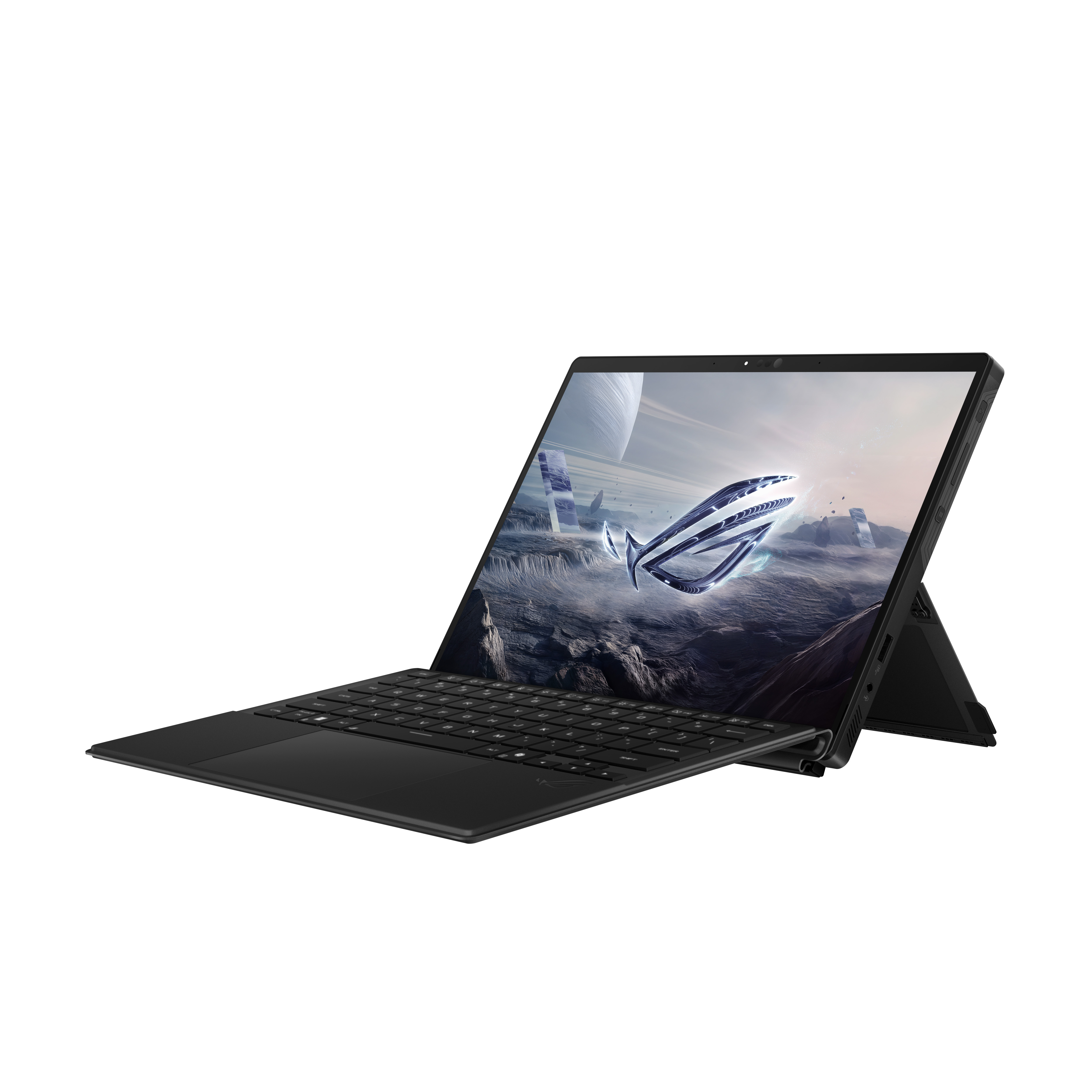 Black laptop, open and propped up, showing a futuristic landscape on screen. Keyboard visible. White background.