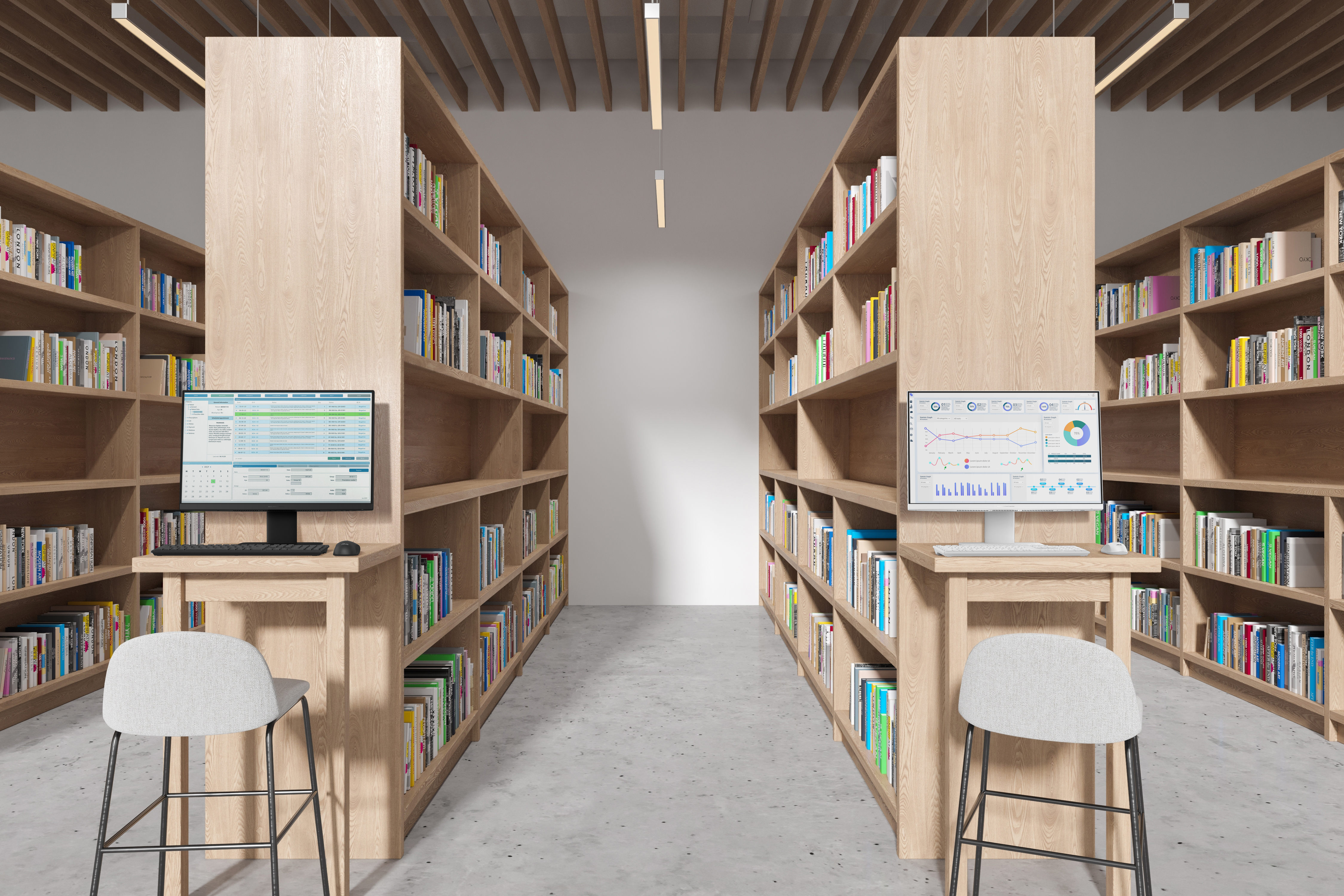 Une bibliothèque avec des étagères de chaque côté. Chacune a un bureau avec un ordinateur et un tabouret. Étagères pleines de livres.
