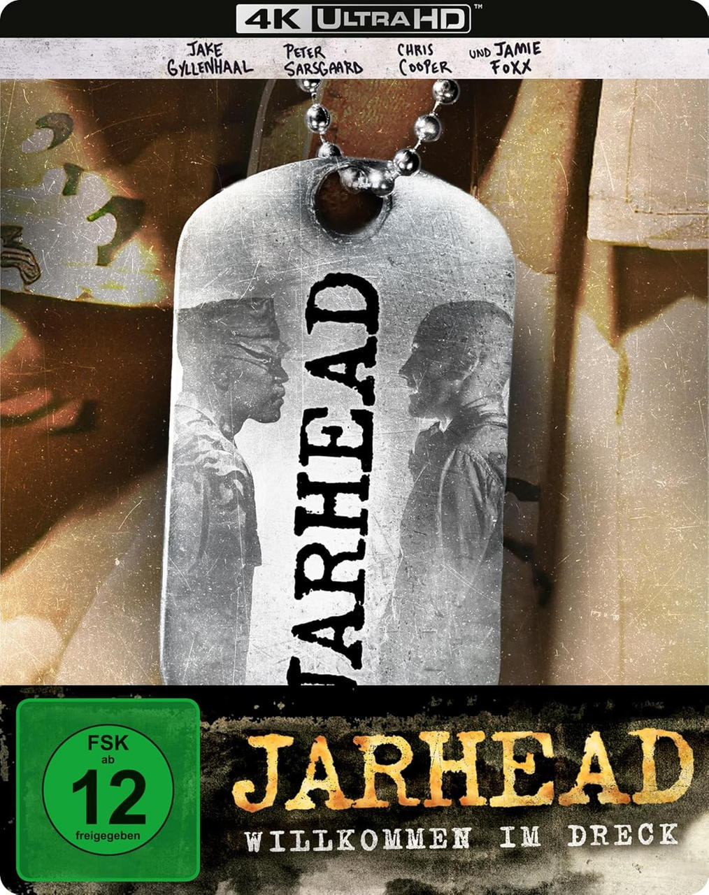 Das Filmposter zeigt ein Hundemarke mit zwei Soldaten, dem Titel 'Jarhead' und Schauspielernamen. Ein grünes Rating-Abzeichen ist in der Ecke.