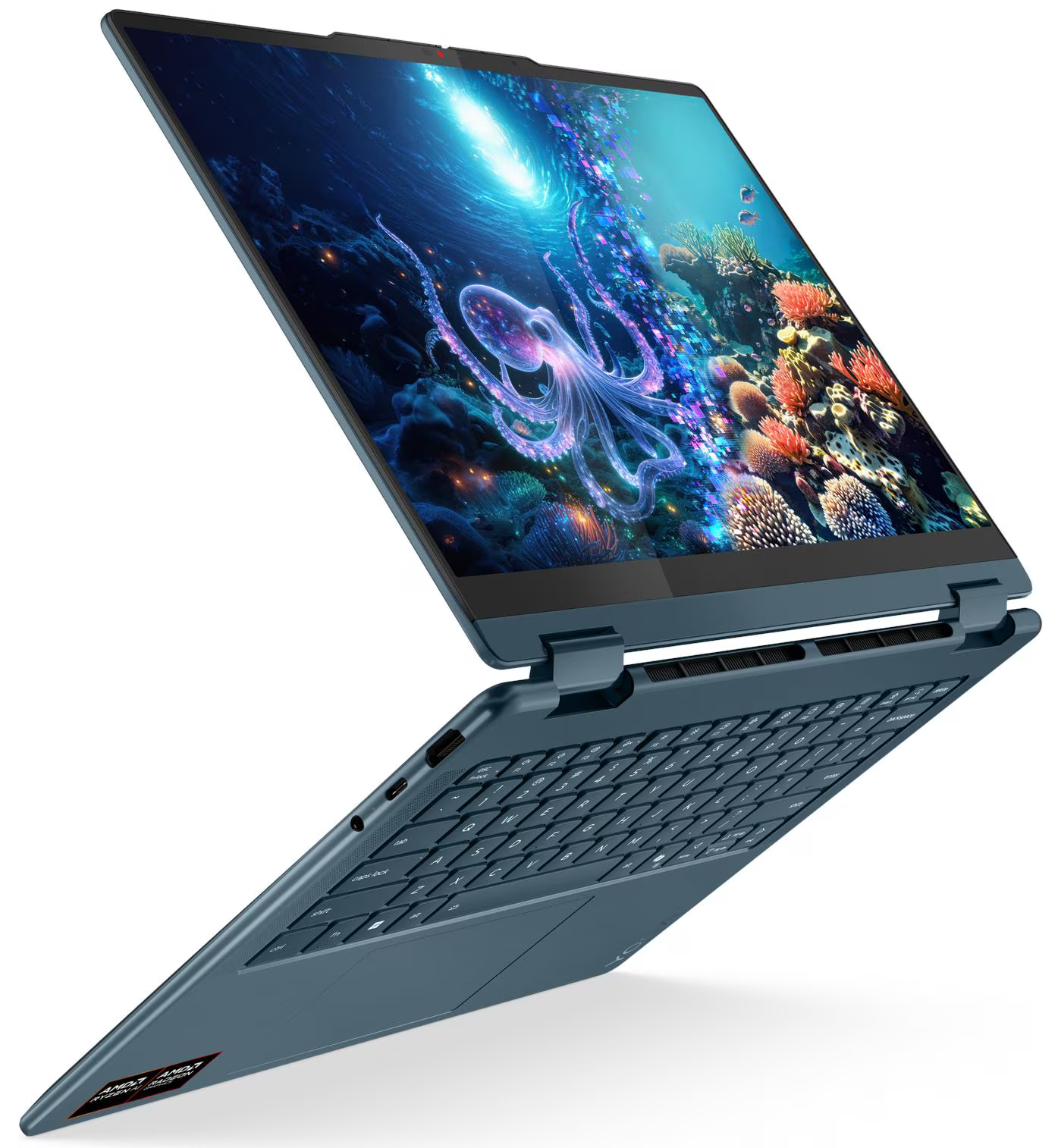 Kék laptop nyitott képernyővel, amely egy tenger alatti jelenetet mutat polippal. A billentyűzet látható.