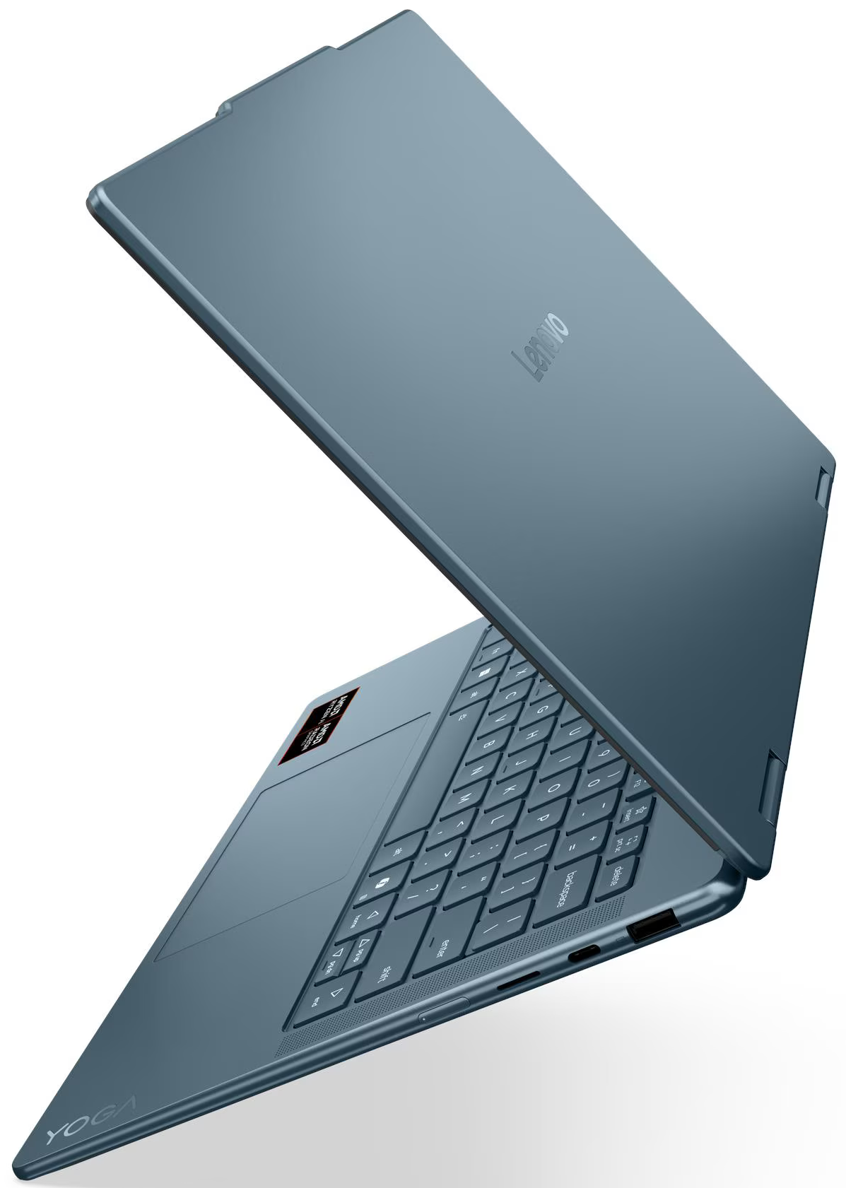 Kék Lenovo Yoga laptop, félig nyitva. Billentyűzet látható, Lenovo logó a fedélen, Yoga felirat alul.