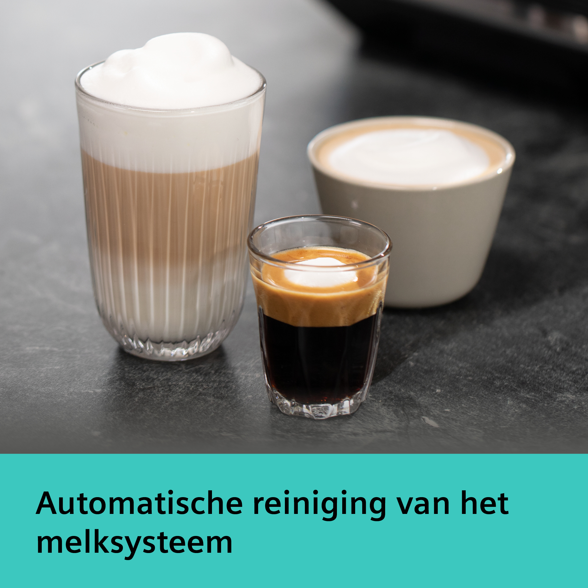 Three coffee drinks: a latte, a cappuccino, and an espresso. All with milk foam. Black surface.