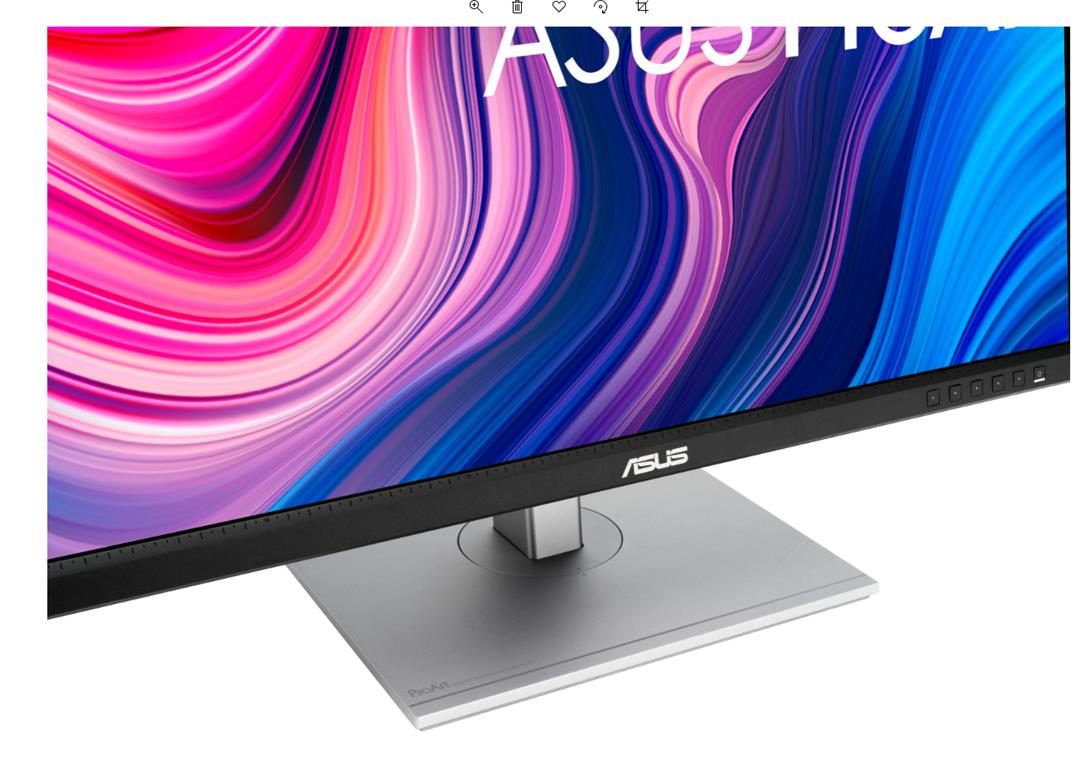Monitor ASUS z kolorowym, abstrakcyjnym wyświetlaczem. Srebrna podstawa i czarna ramka. Widoczne słowo ASUS.