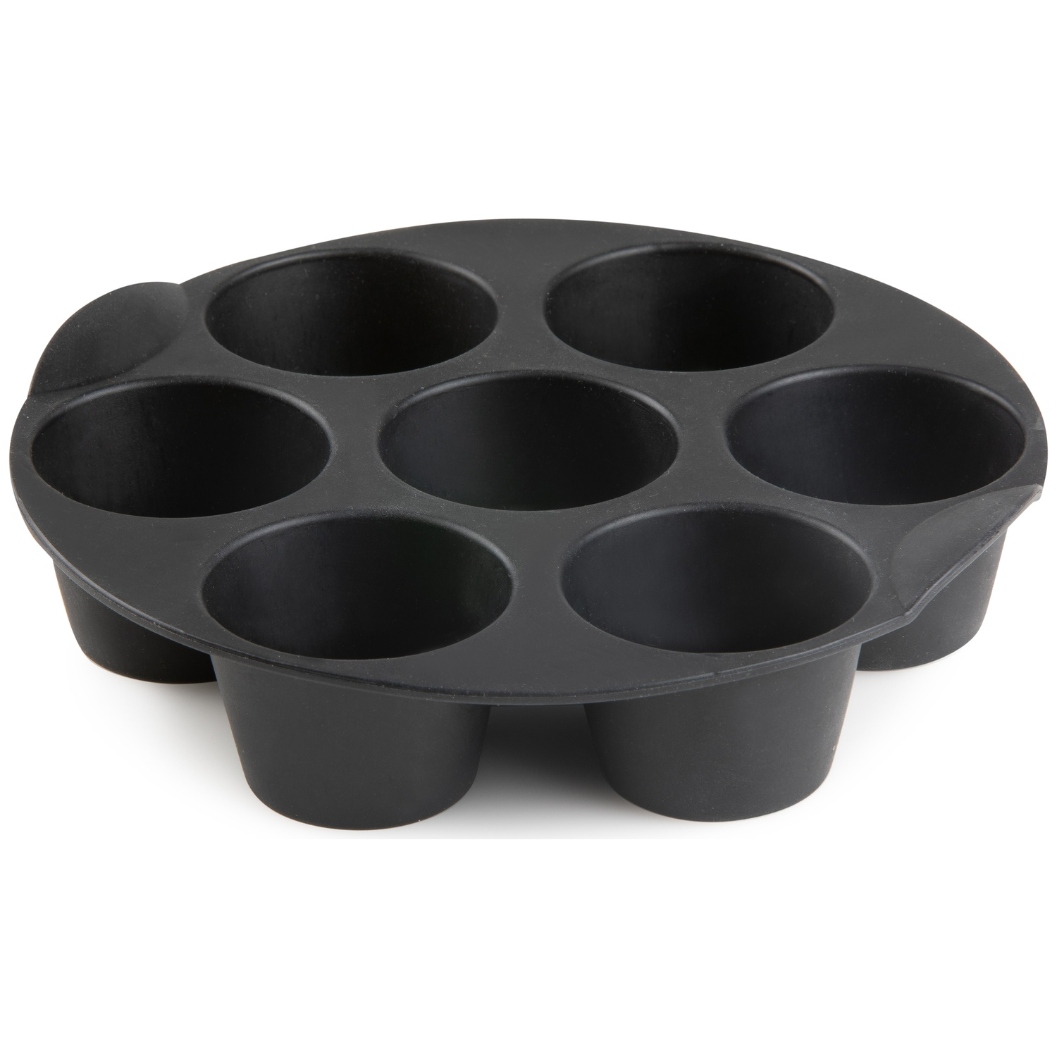 A black muffin tin with seven cups is on a white surface. The tin has a handle on one side.