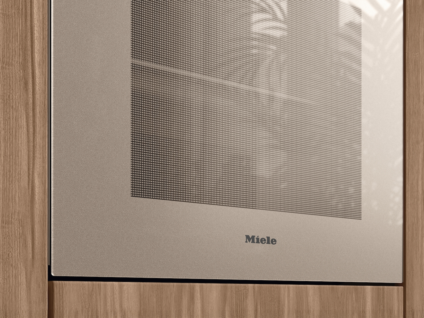 Nahaufnahme eines Miele-Geräts. Die Oberfläche ist beige mit einem Rastermuster. Holzrahmen an den Seiten. Das Miele-Logo ist sichtbar.