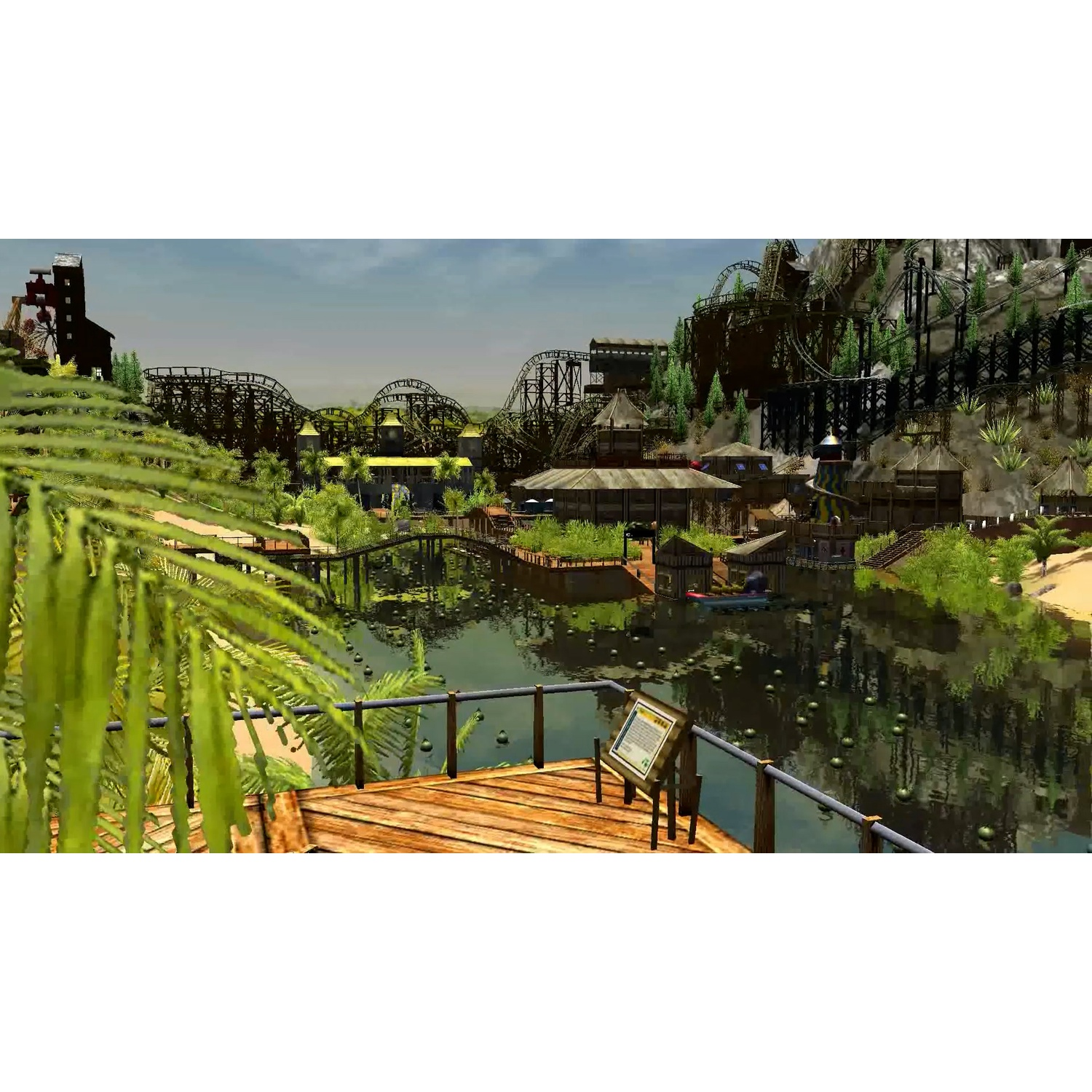 Themapark met achtbanen, water, houten loopbruggen en gebouwen. Weelderig groen omringt het park met blauwe lucht.
