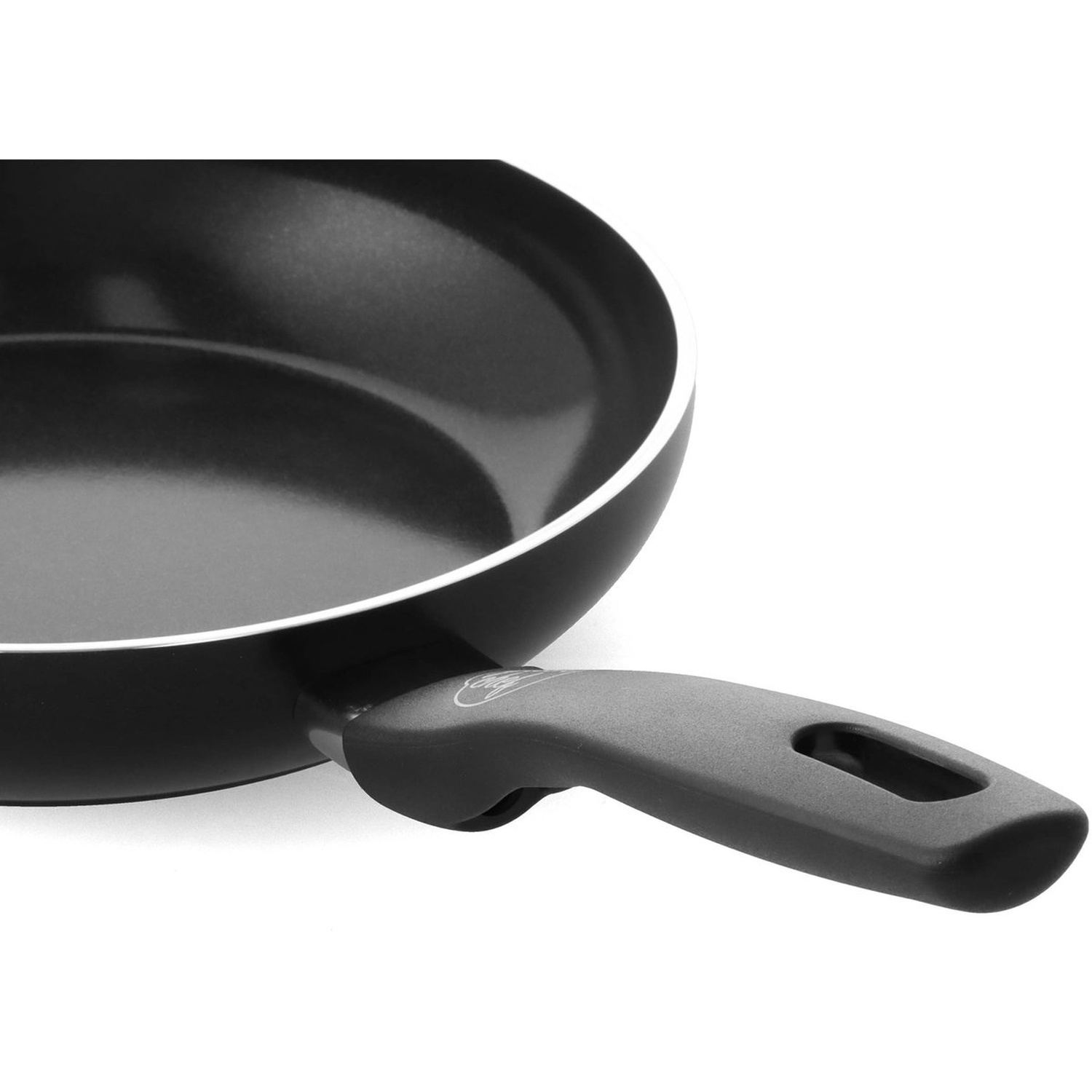 Close-up of a black frying pan with a handle. The pan is on a white background. The interior of the pan is black.