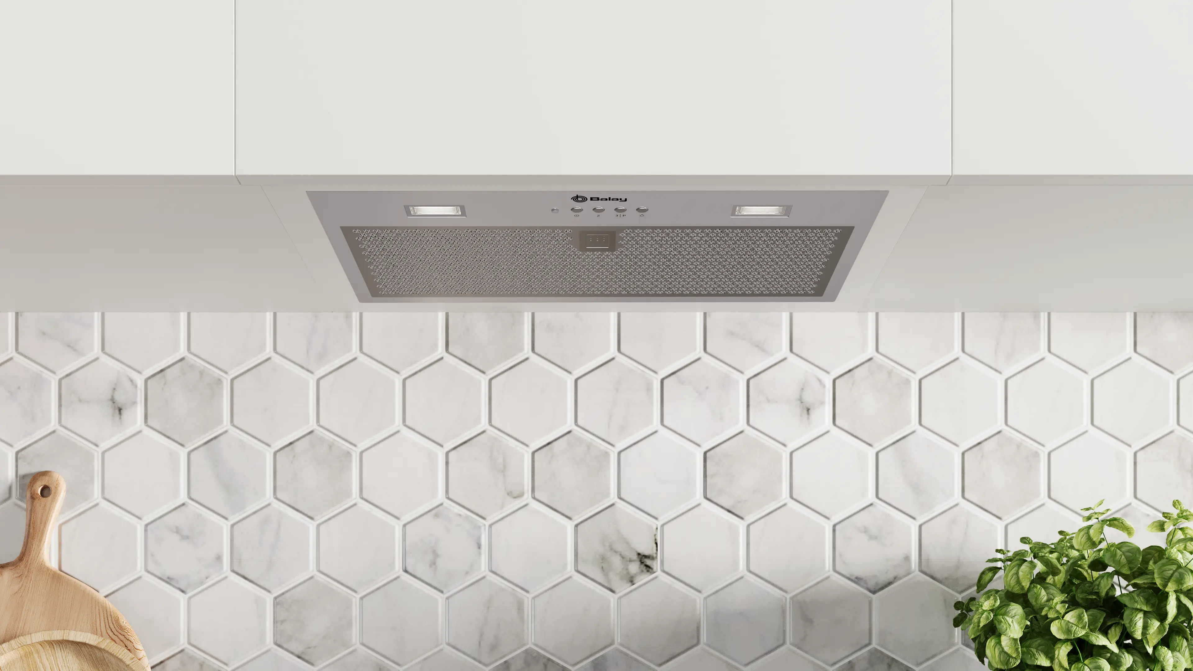 Una escena de cocina con una campana extractora plateada, armarios blancos y baldosas hexagonales de mármol. Se ve una tabla de cortar de madera.
