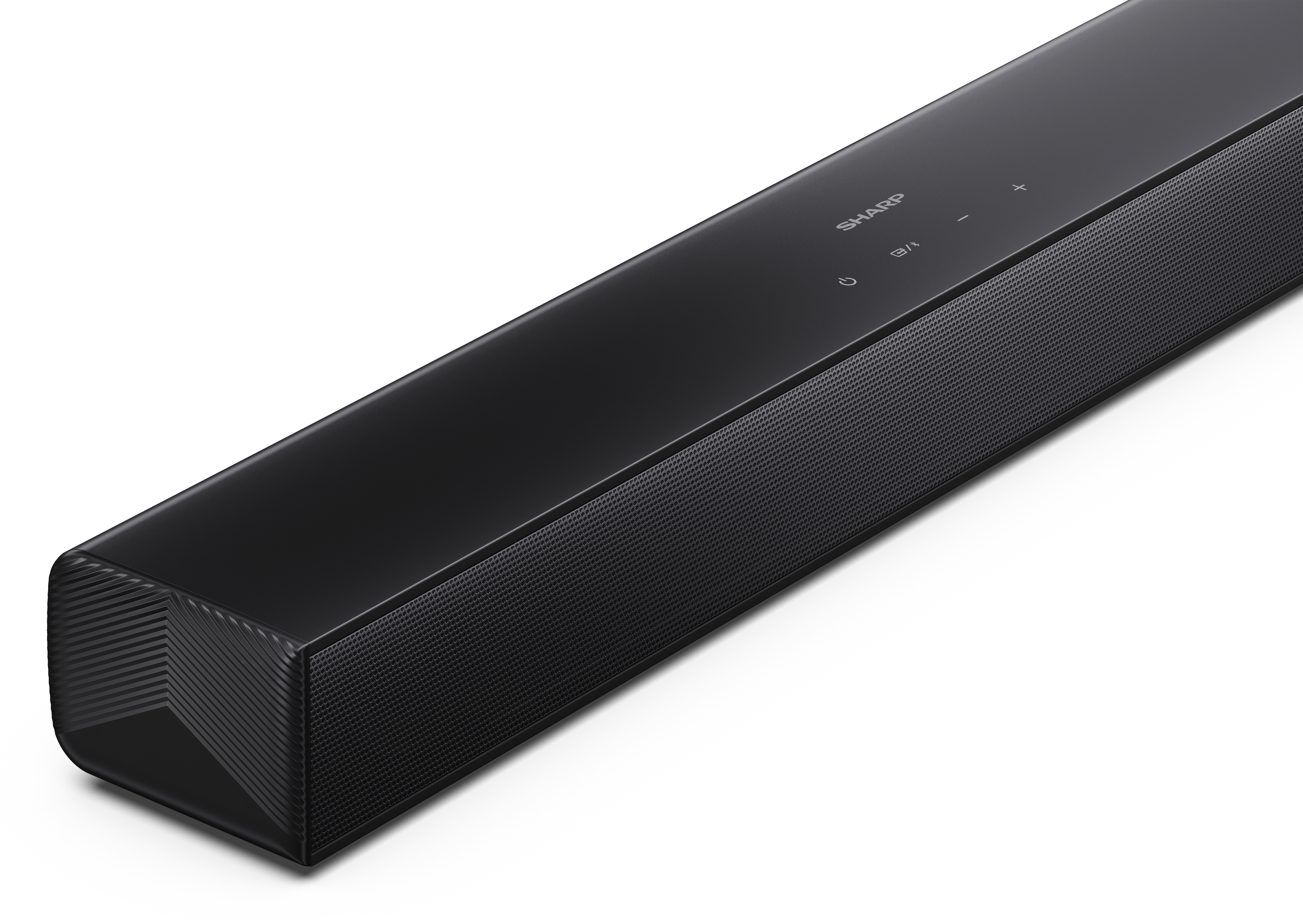 Czarny soundbar na białej powierzchni. Ma markę SHARP. Przyciski są widoczne na górze.