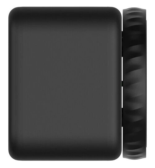 Czarne prostokątne urządzenie z rowkowanym kołem z boku. Urządzenie znajduje się na białym tle.