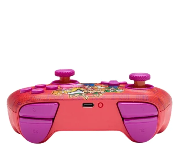 Różowy kontroler Nintendo Switch z postaciami z kreskówek. Ma fioletowe przyciski i joysticki. Tło jest białe.