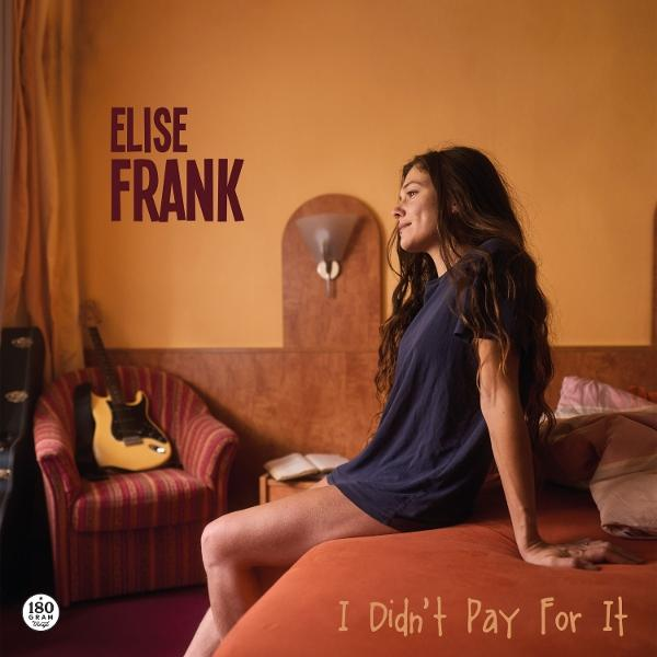 Frau in blauem Shirt sitzt auf rotem Bett. Im Hintergrund Gitarre, Stuhl und Text 'Elise Frank'. Albumtitel, 'I Didn't Pay For It'.