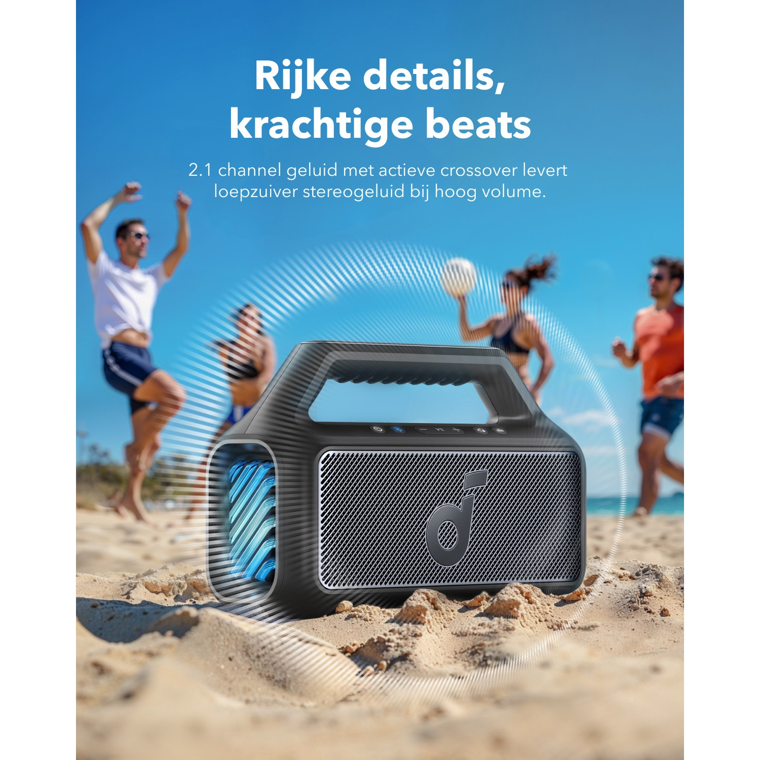 A black speaker on sand with people in the background playing. Blue sky. Text: Rijke details, krachtige beats.