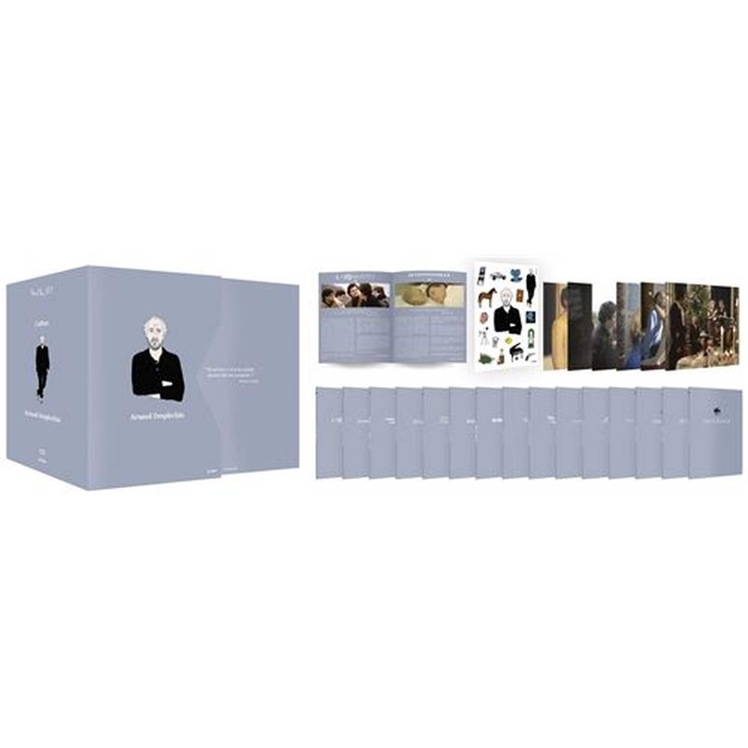 Un coffret avec un portrait d'homme, des livres ouverts, des cartes avec des images et plusieurs couvertures de livres grises.