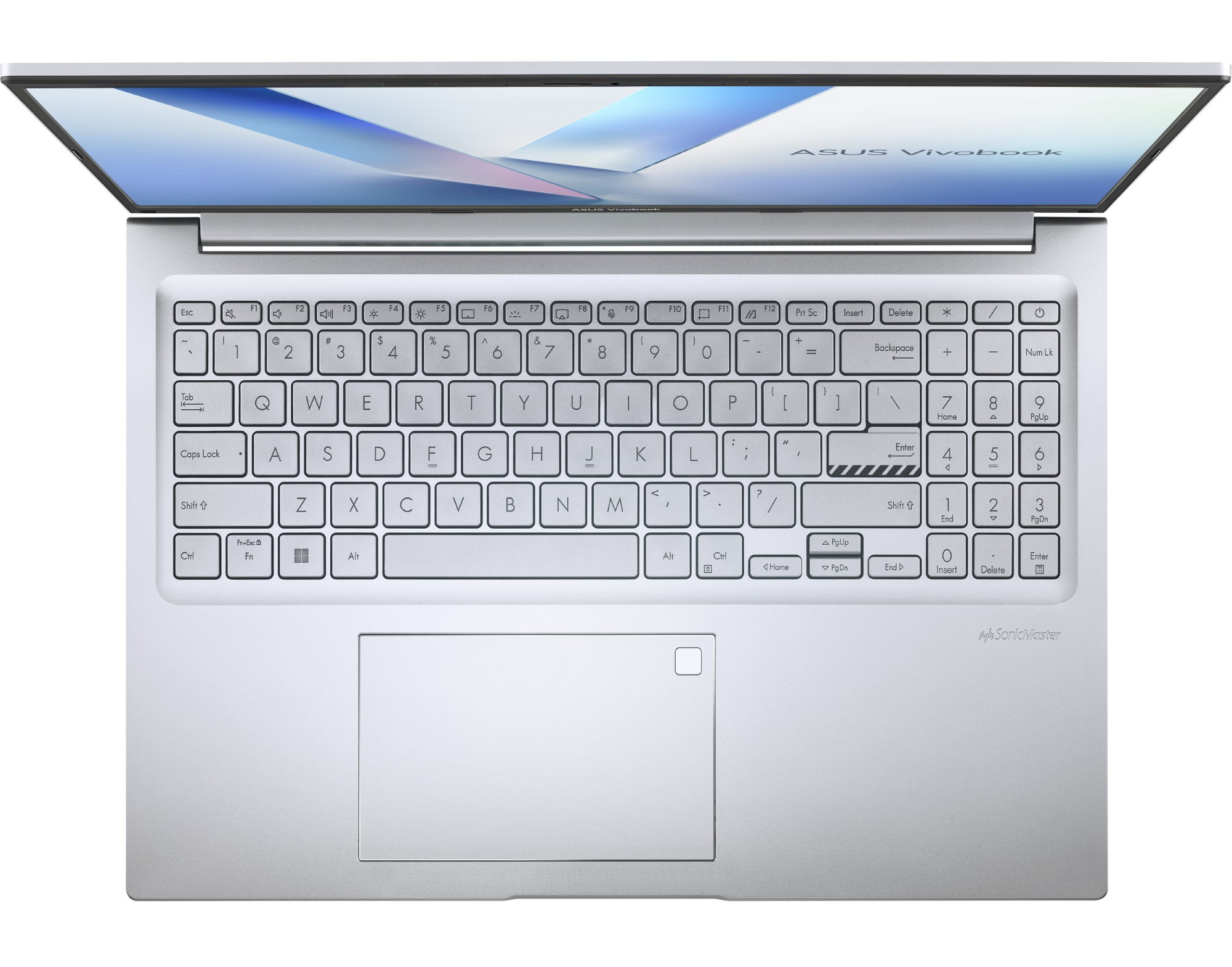 Otwarty srebrny laptop na białej powierzchni. Klawiatura jest w centrum uwagi, z klawiszami pokazującymi litery i cyfry.