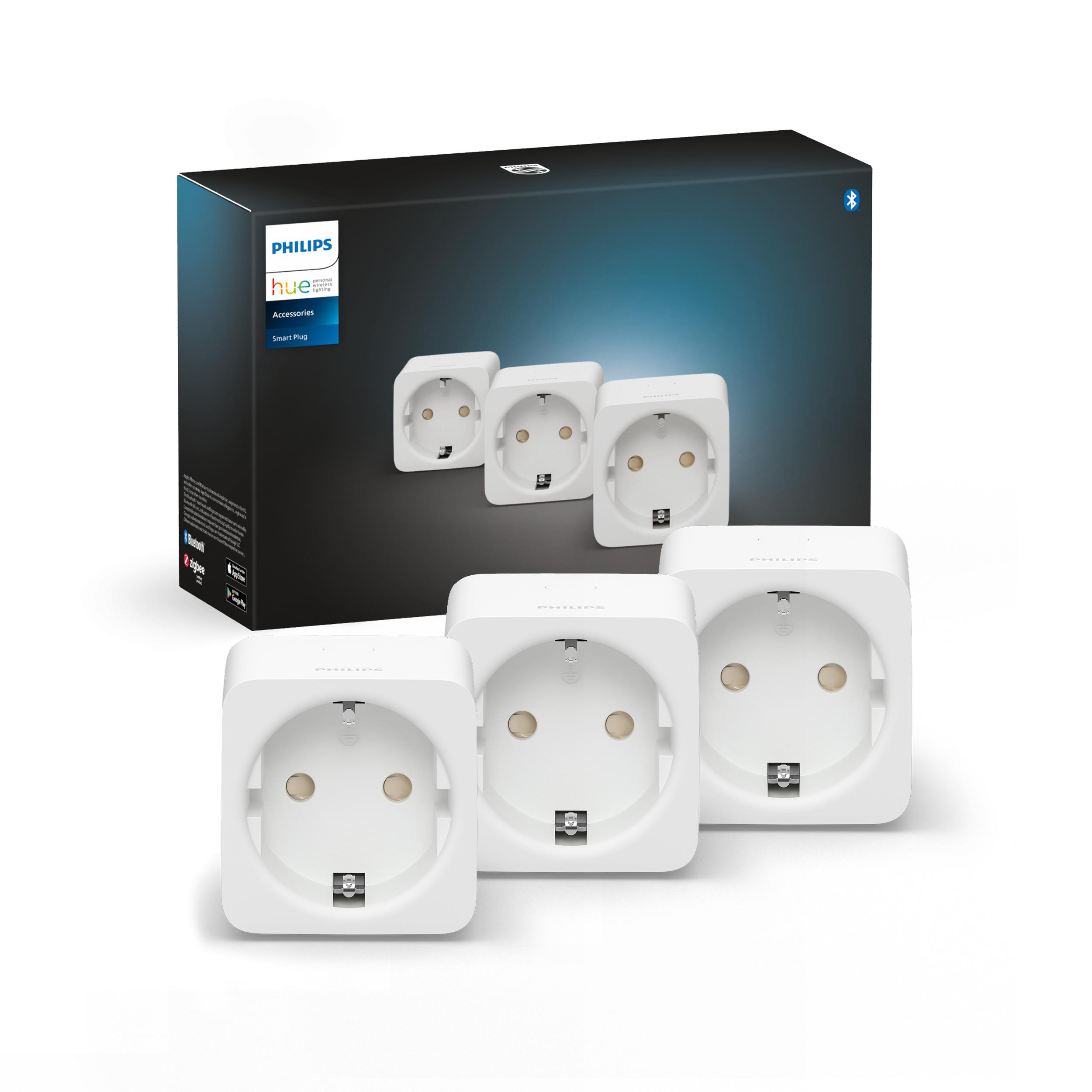 Das Bild zeigt eine Philips Hue Smart Plug Box mit drei weißen Smart Plugs davor.