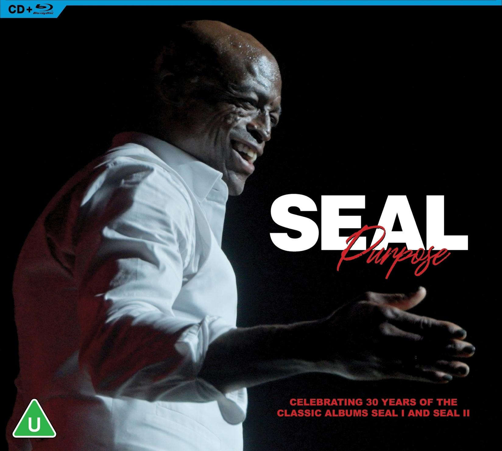 Seal lächelt in einem weißen Hemd, mit dem Titel 'Seal Purpose'. Das Bild feiert 30 Jahre seiner Alben, mit Blu-ray Disc Logo.
