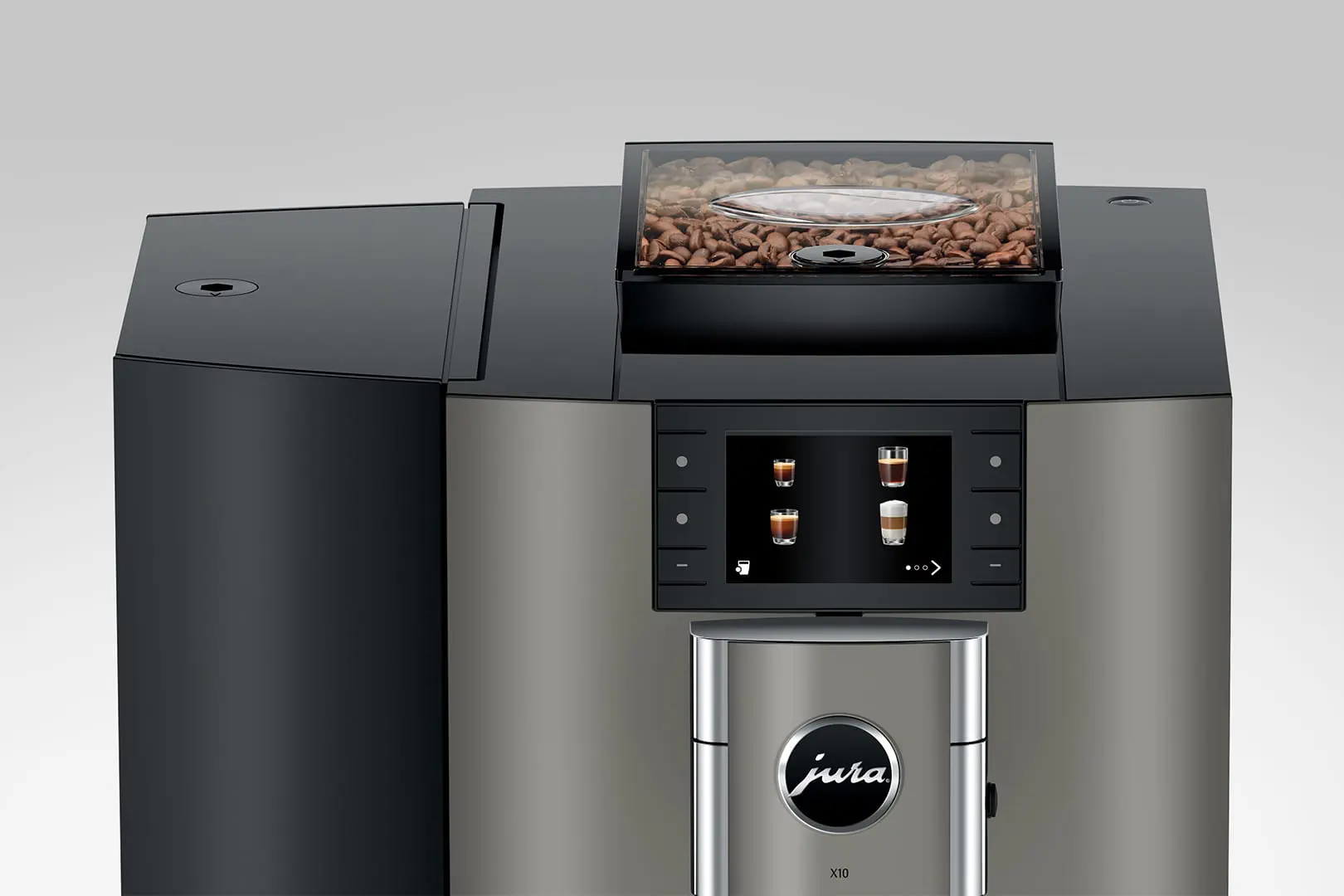 Un primo piano di una macchina da caffè Jura X10. Mostra chicchi di caffè, un touchscreen e il logo Jura.