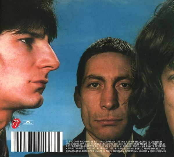 Albumhoes met drie mannengezichten. Eén gezicht is in profiel. Het Rolling Stones-logo is zichtbaar. Streepjescode en copyright-info onderaan.