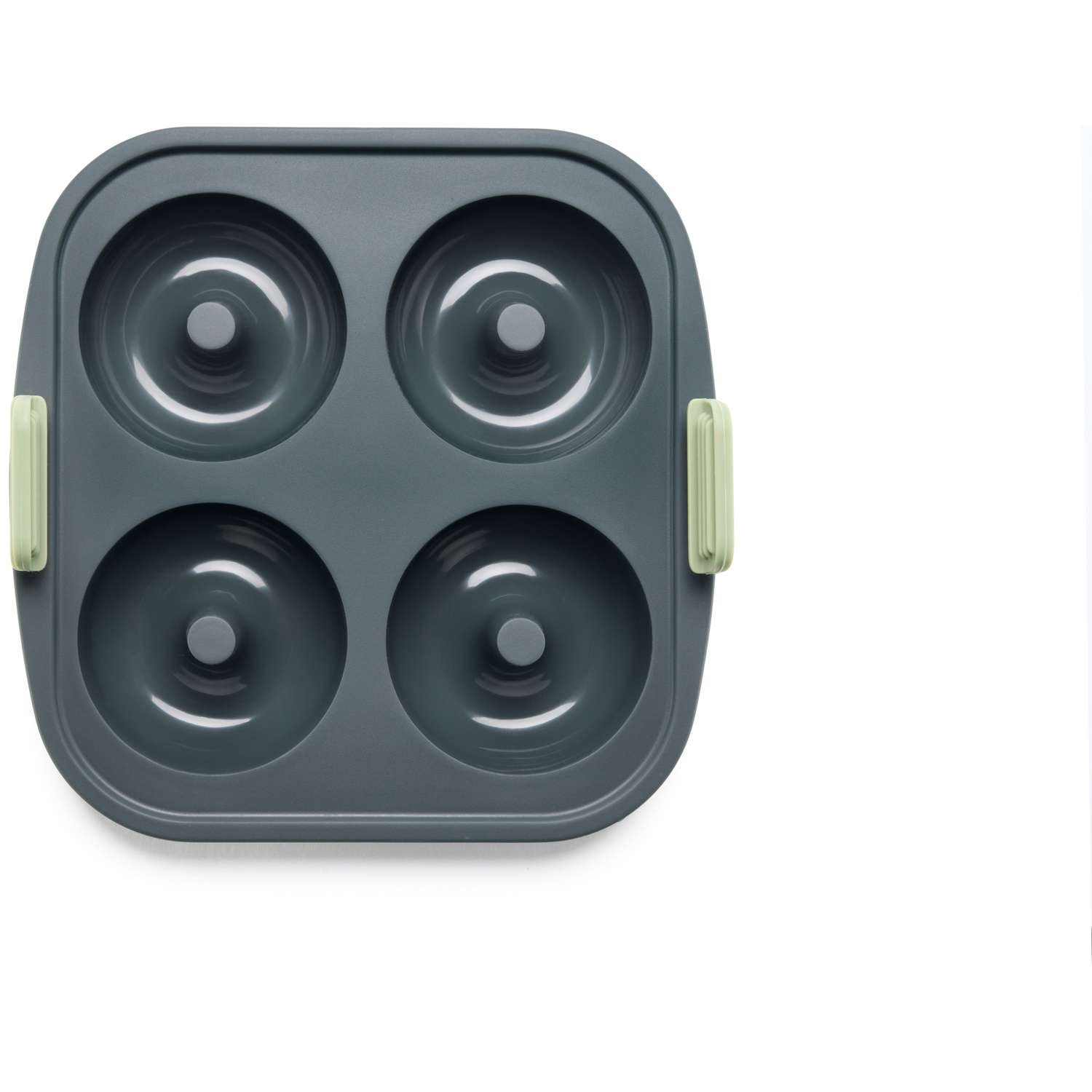 Top-down view of a dark grey donut pan with four donut molds. Light green handles are on each side. White background.
