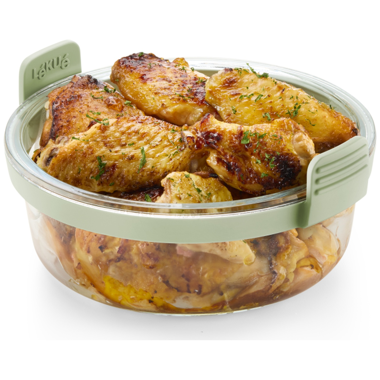 Roasted chicken pieces in a clear glass container with a green lid. The chicken is golden brown with herbs on top.