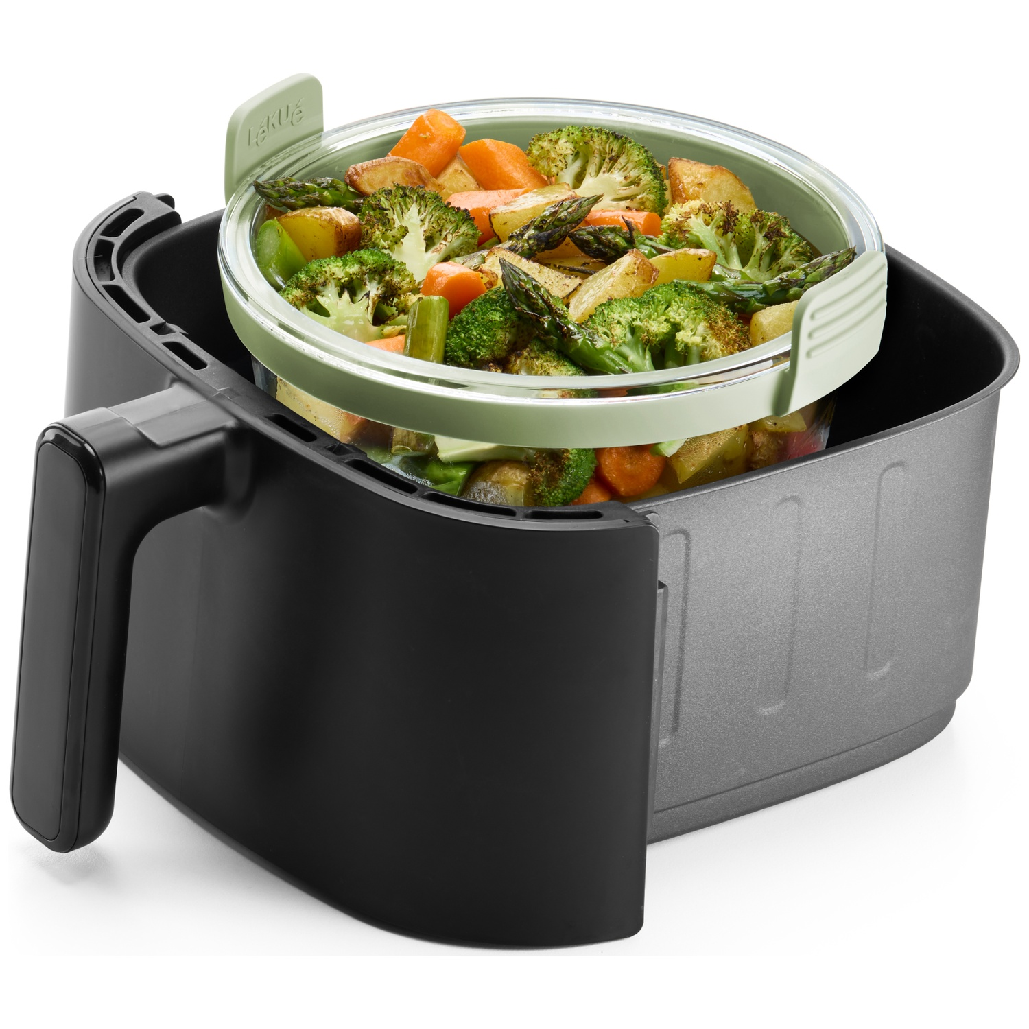 An air fryer with a basket of cooked vegetables: broccoli, carrots, potatoes, and asparagus. The air fryer is black and gray.