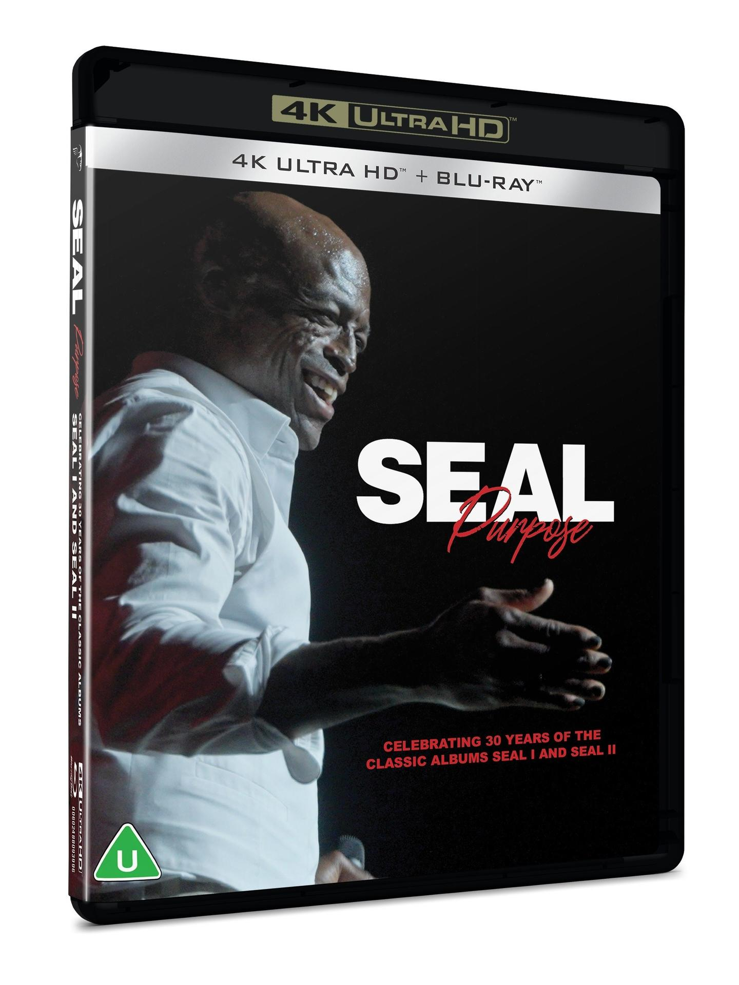 Das Cover zeigt Seal, der lächelt und ein weißes Hemd trägt. Der Text „Seal Purpose“ ist sichtbar. Es ist eine 4K Ultra HD Blu-ray Disc.
